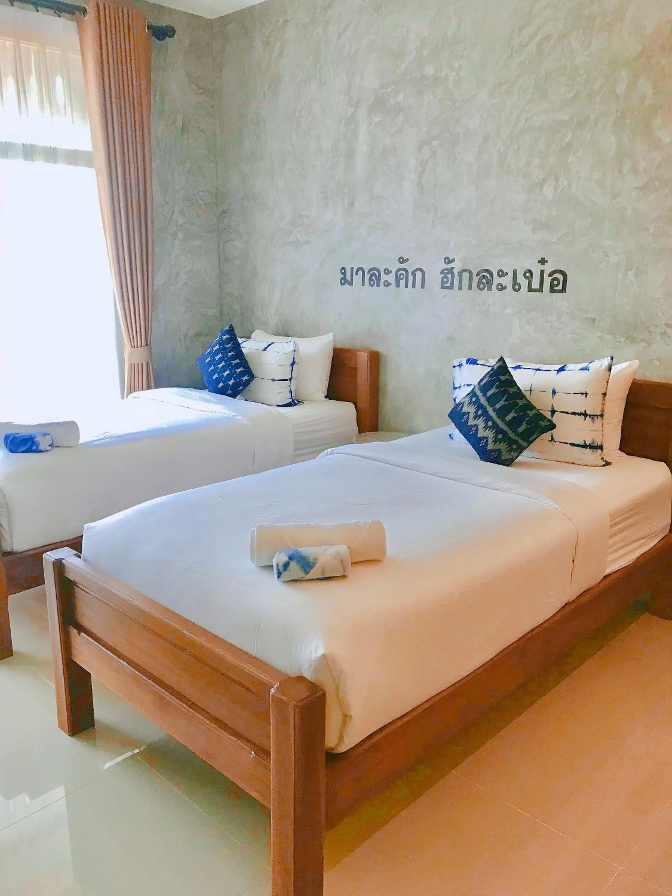 Bed in Hug Sakhonnakhon Hotel