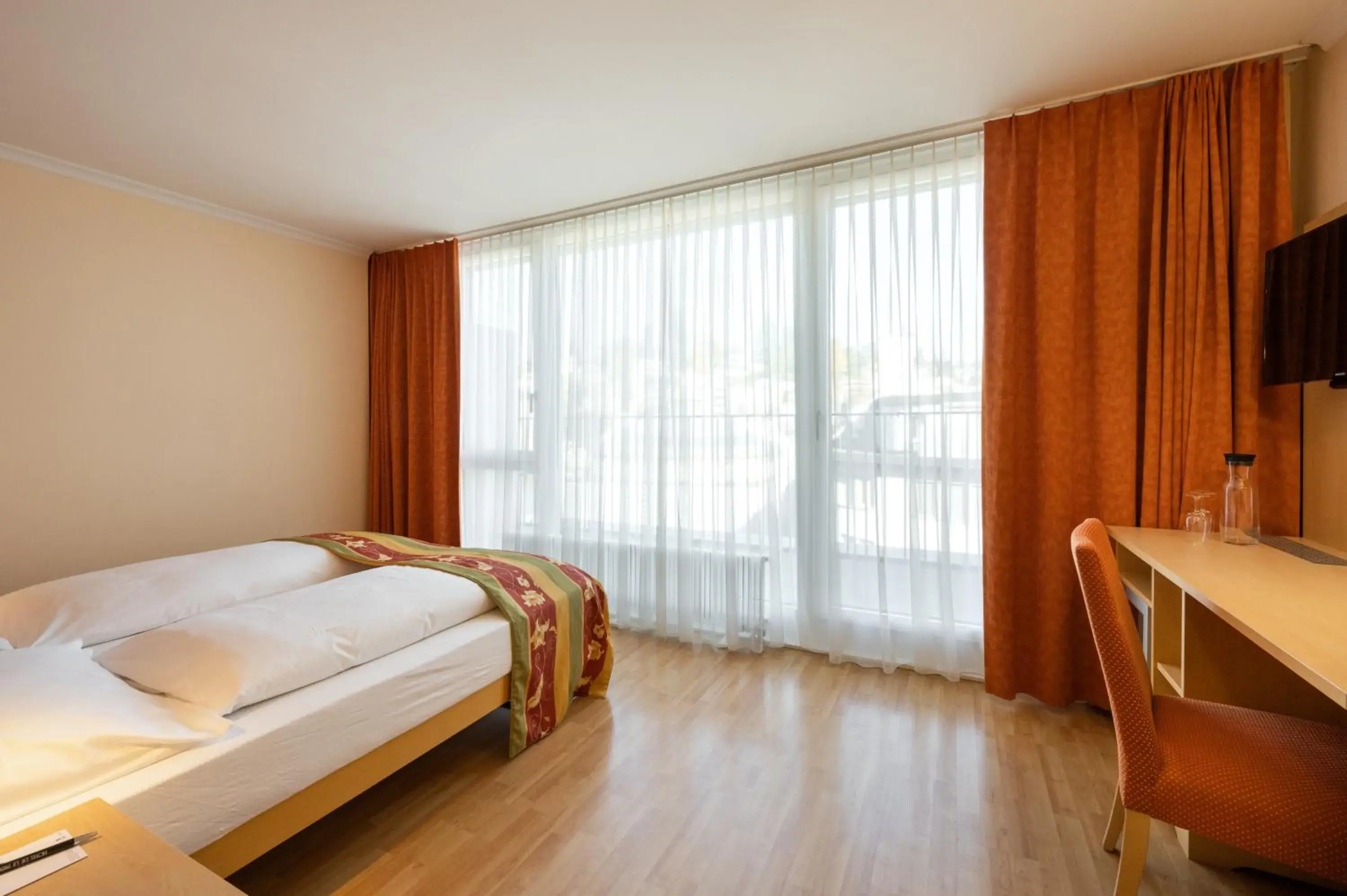 Living room, Bed in Ambassador Self Check-in Hotel Living room, Bed in Ambassador Self Check-in Hotel