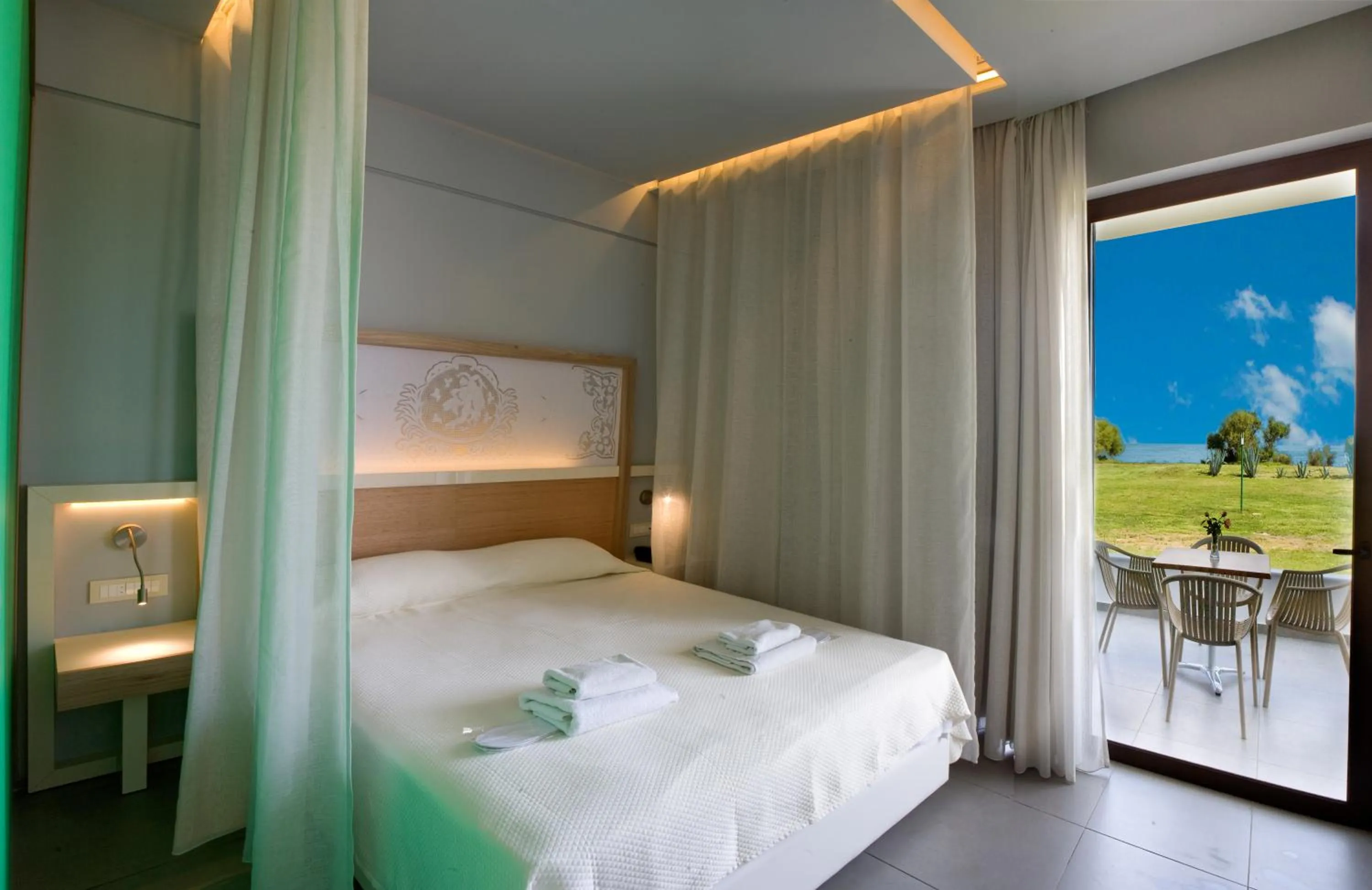 Bed in Geraniotis Hotel and Resort