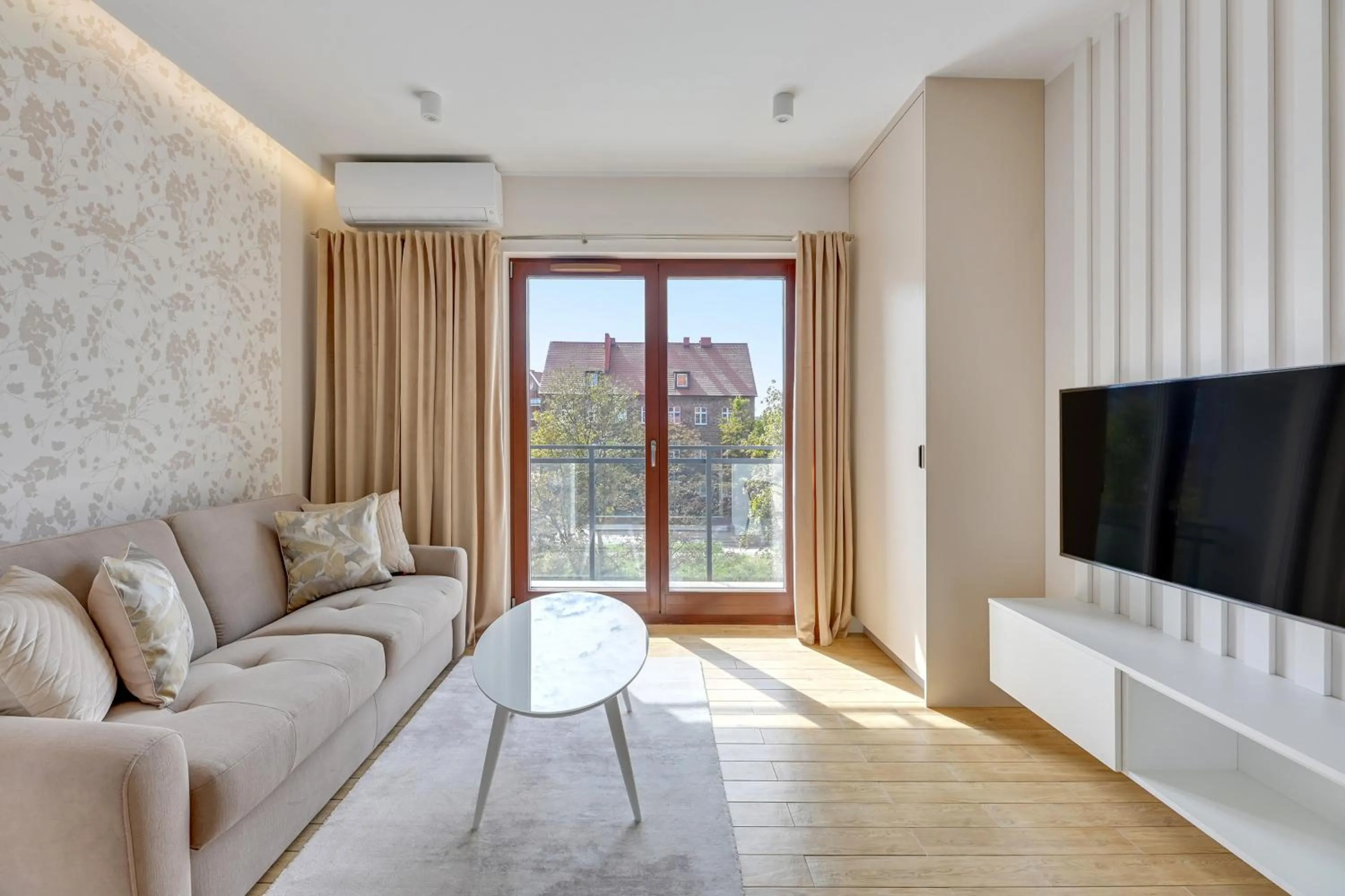 TV and multimedia in Aura III Apartments & Free Parking by Downtown Apartments