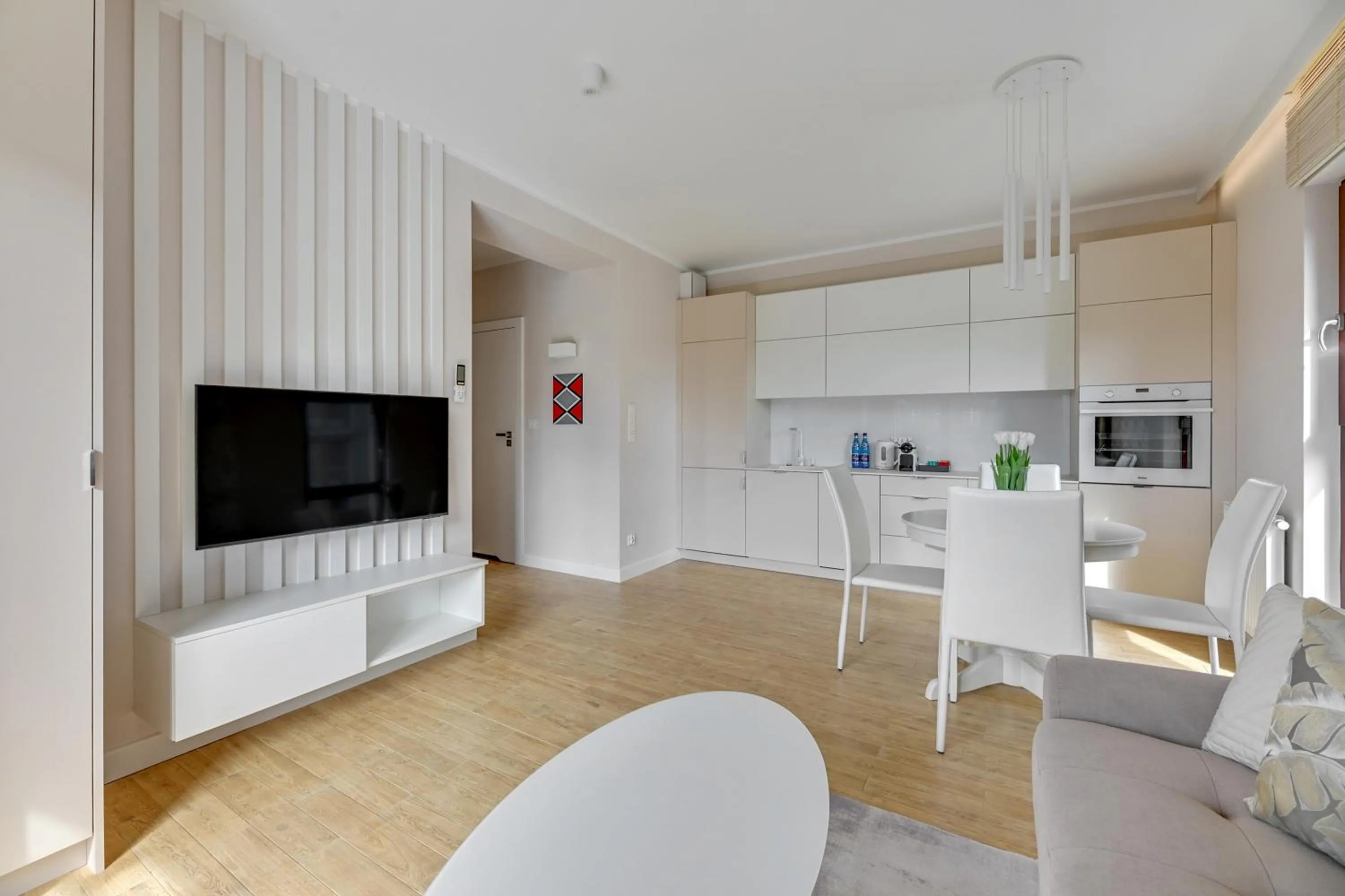 TV and multimedia in Aura III Apartments & Free Parking by Downtown Apartments