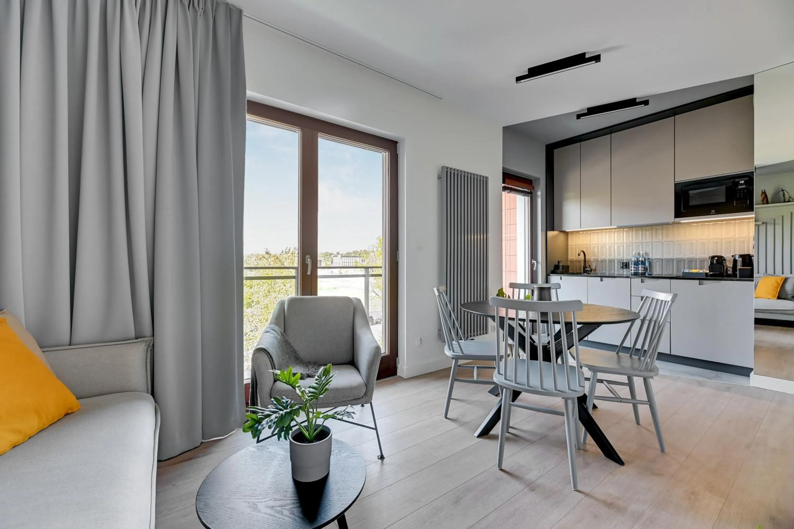 Living room in Aura III Apartments & Free Parking by Downtown Apartments