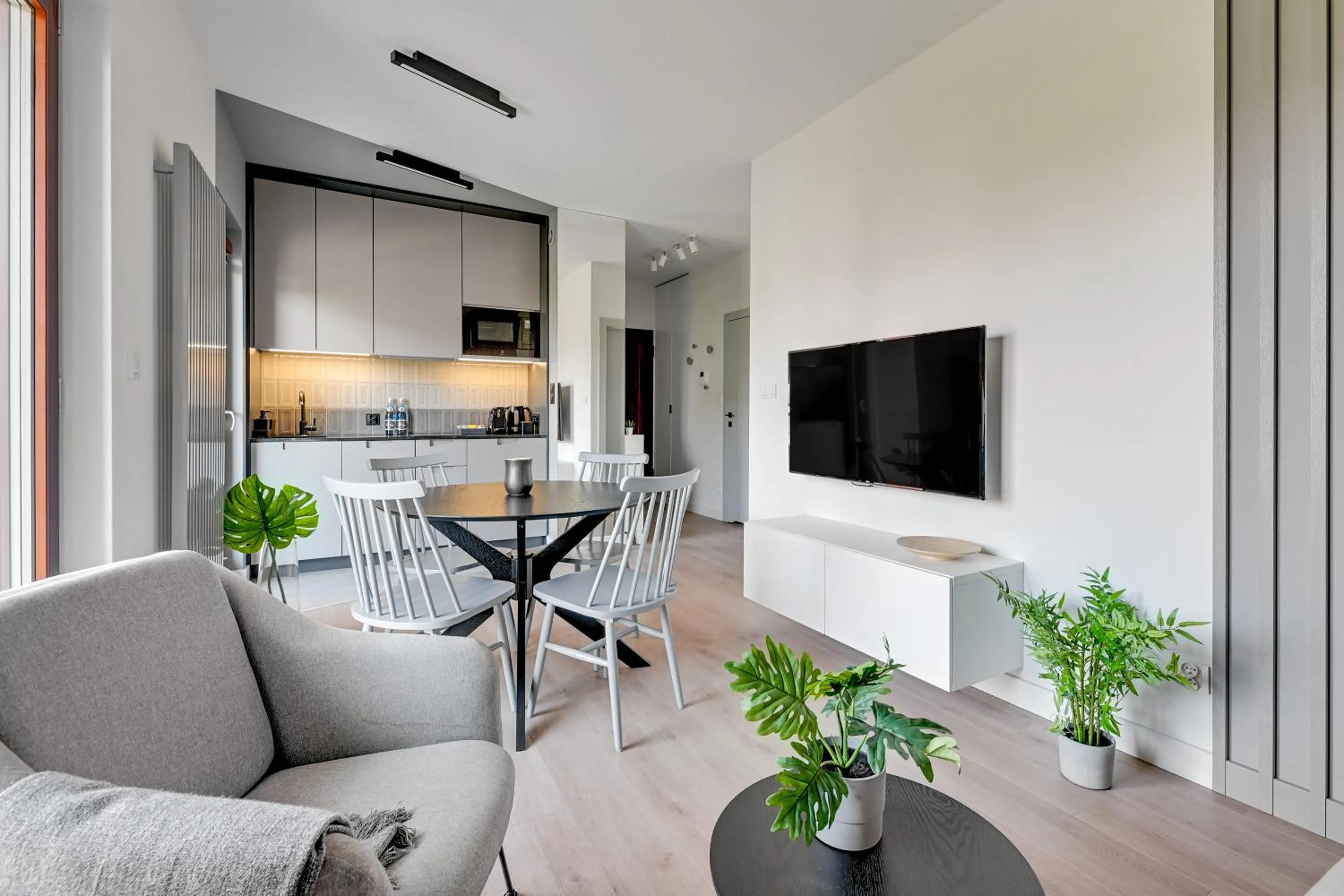 Living room in Aura III Apartments & Free Parking by Downtown Apartments