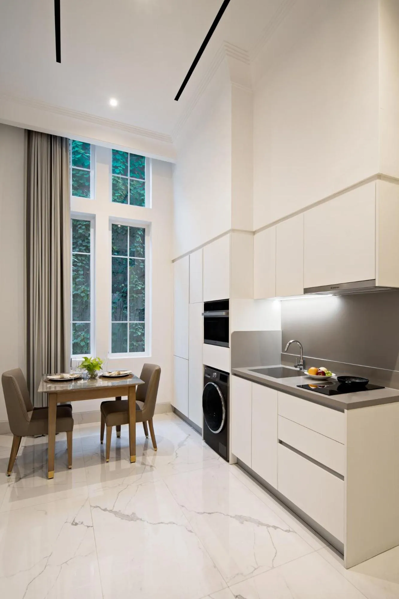 Kitchen or kitchenette in The Grand Mansion Menteng by The Crest Collection
