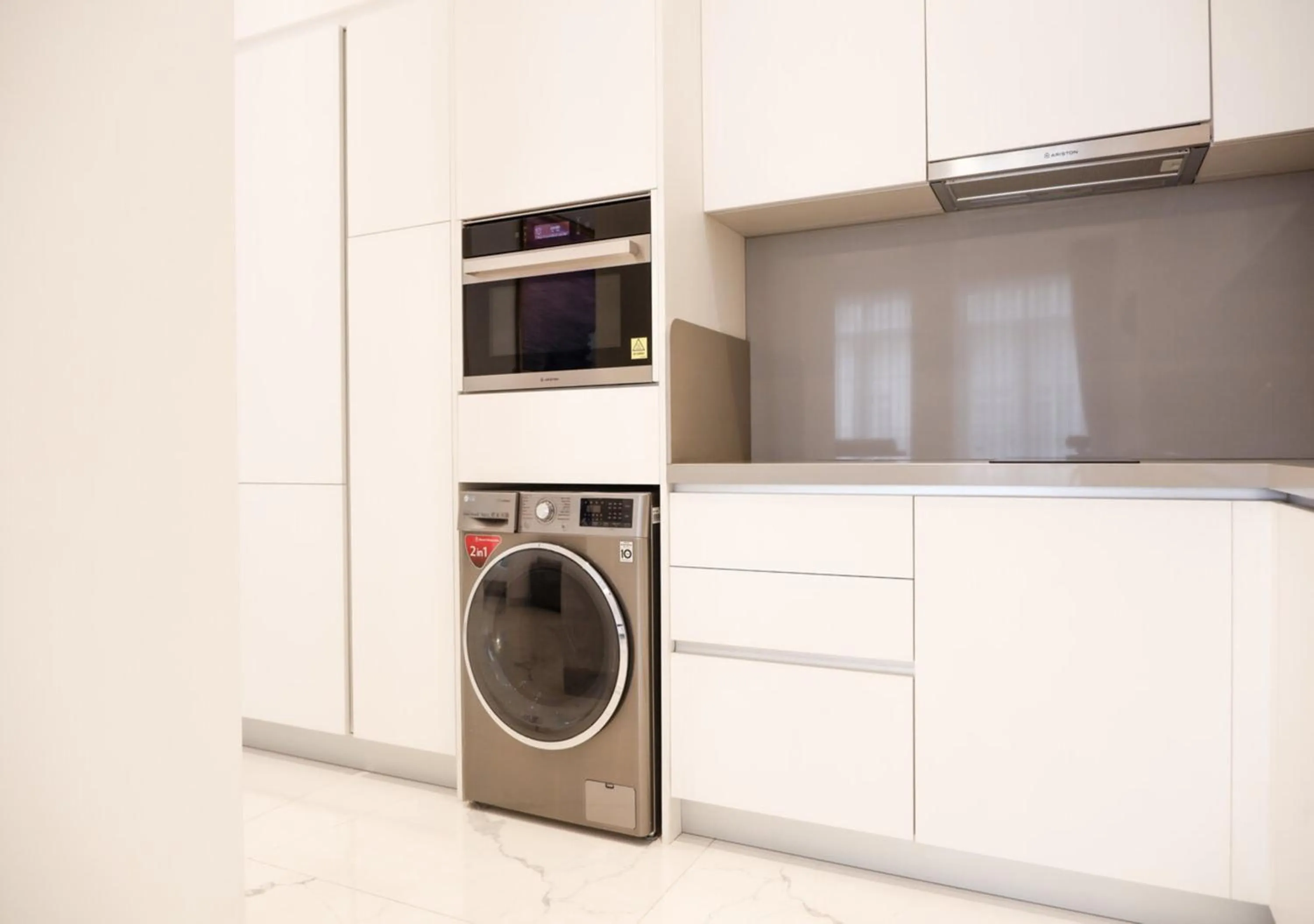 kitchen in The Grand Mansion Menteng by The Crest Collection