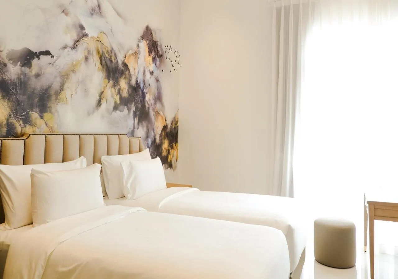 Bed in The Grand Mansion Menteng by The Crest Collection