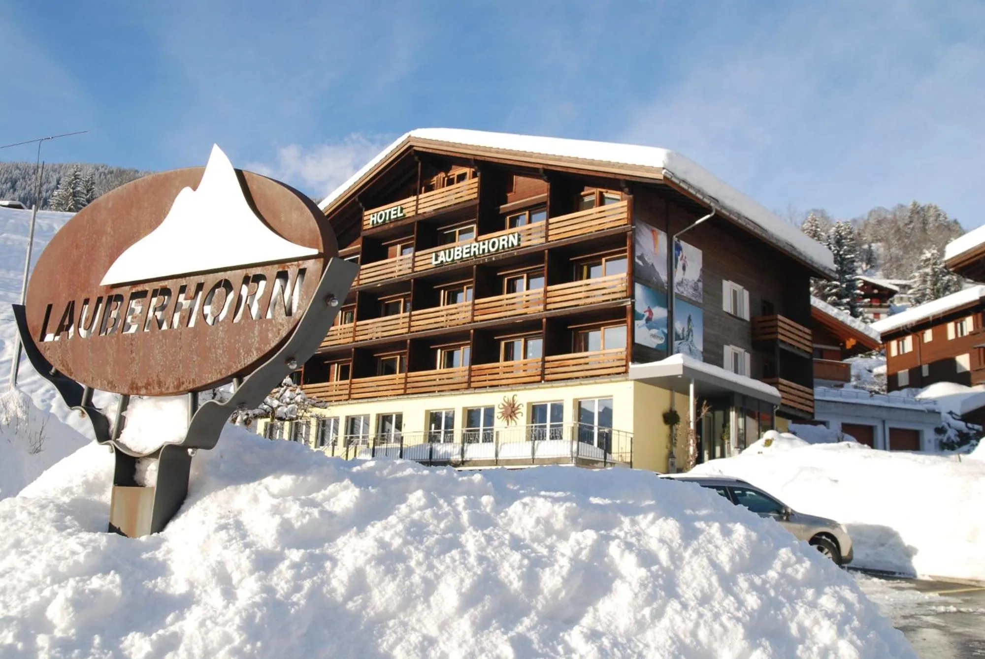 Facade/entrance, Winter in Hotel Lauberhorn - Home for Outdoor Activities