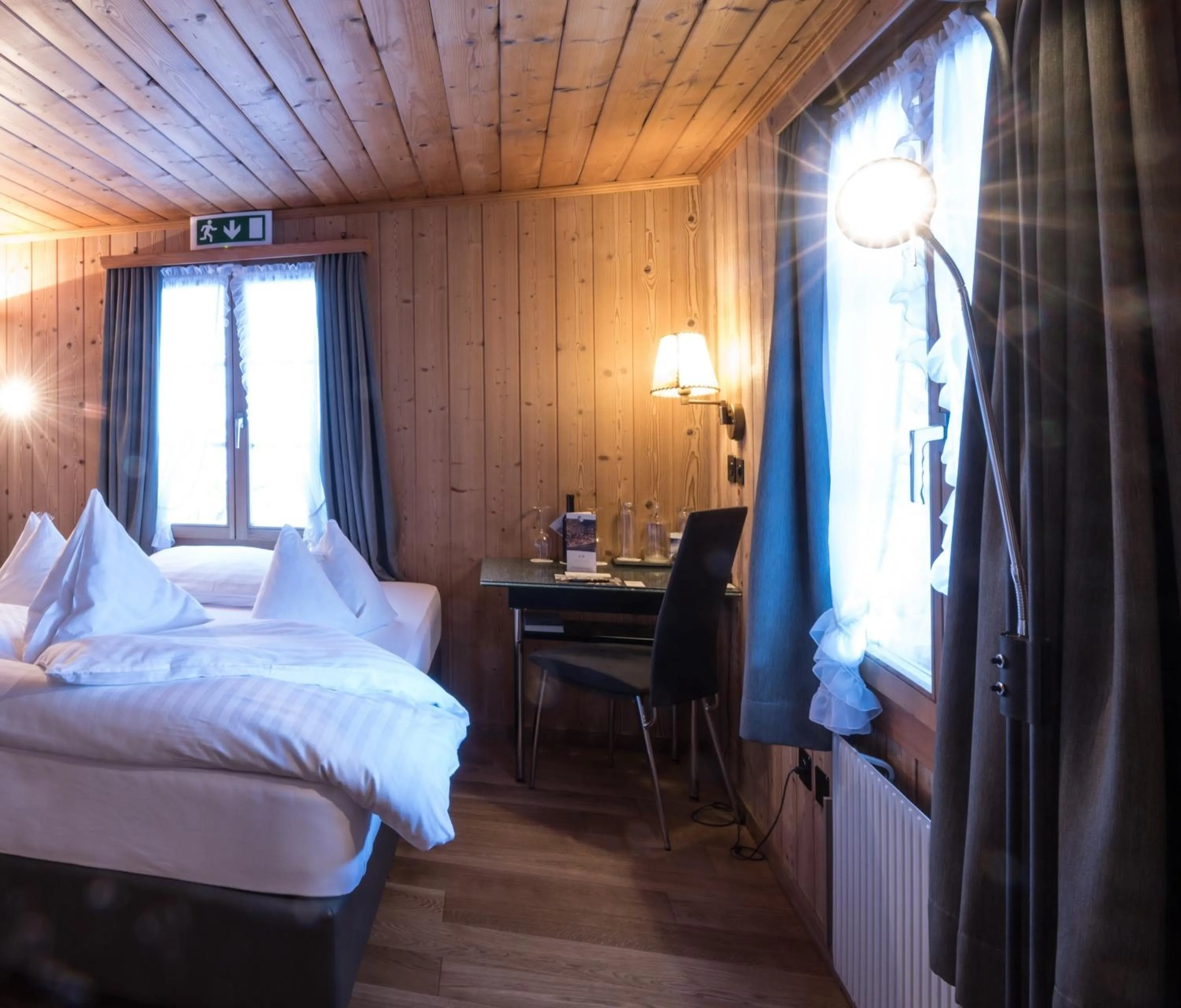 Photo of the whole room, Bed in Hotel Kemmeriboden-Bad AG