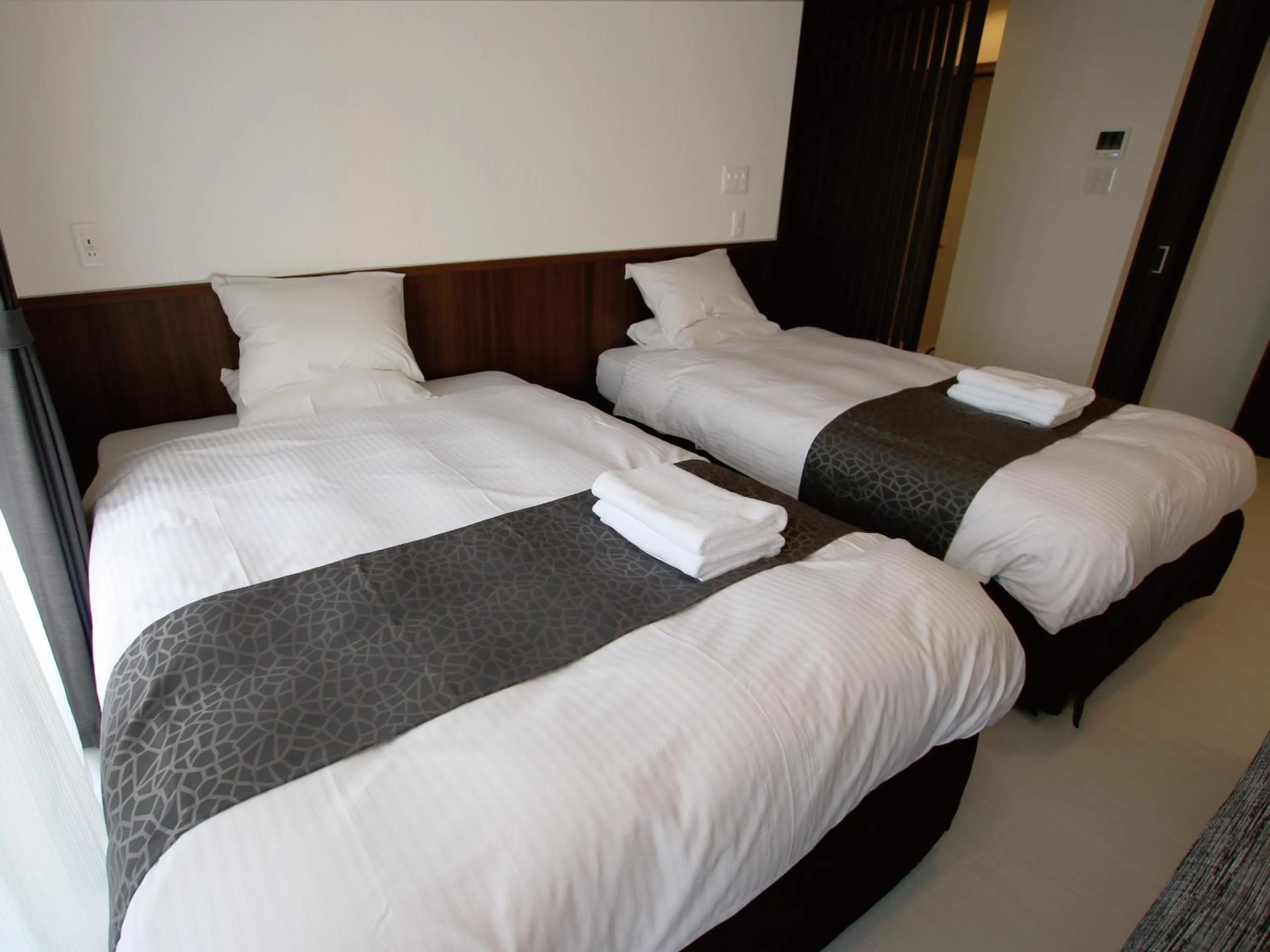 Bed in Sunset Resort Mihama -SEVEN Hotels and Resorts-