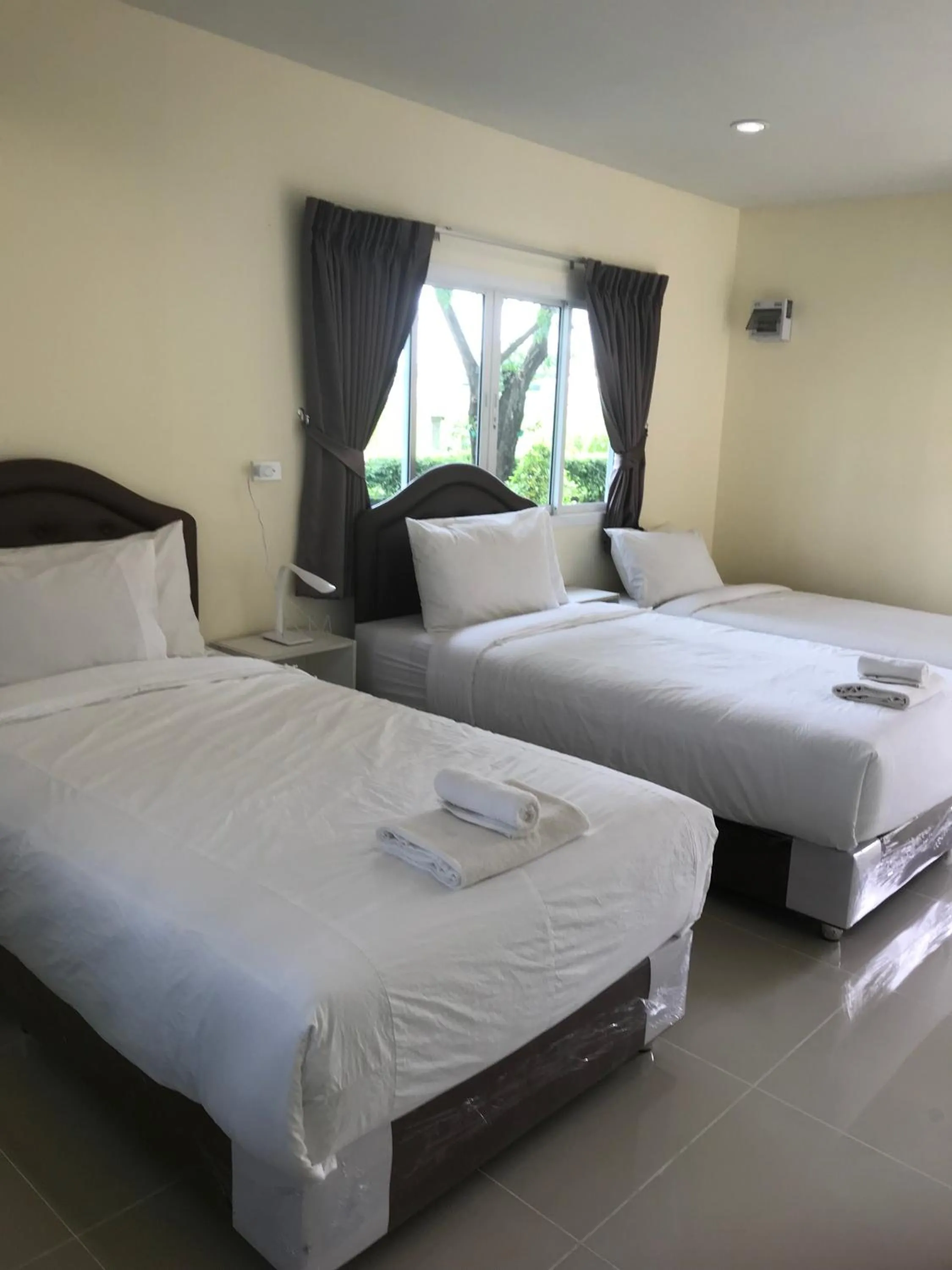 Bed in Sripiamsuk Resort Bangkok
