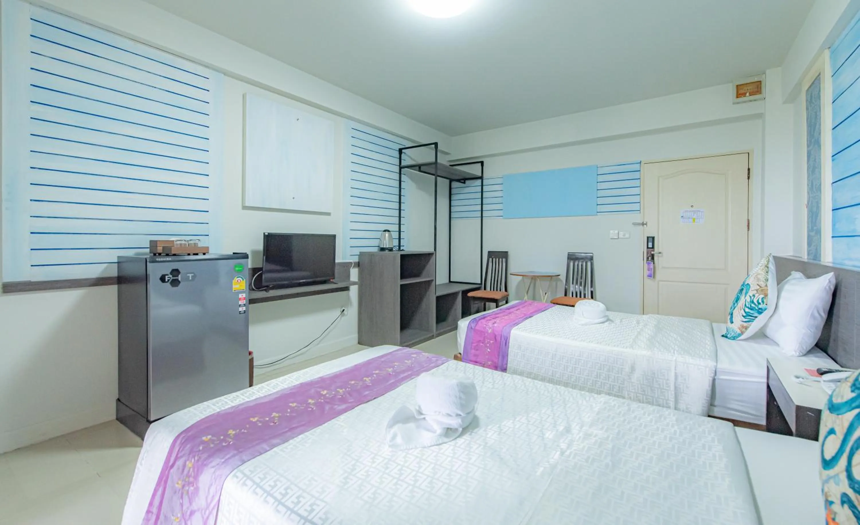 Bed in The Wing Design Hotel