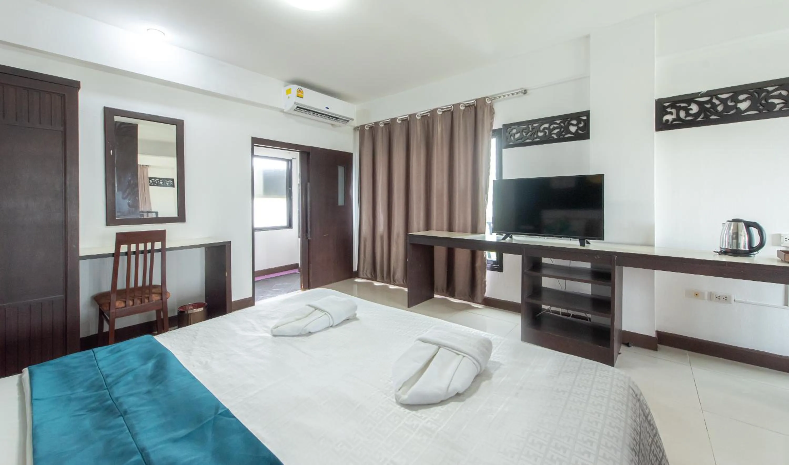 Bed in The Wing Design Hotel