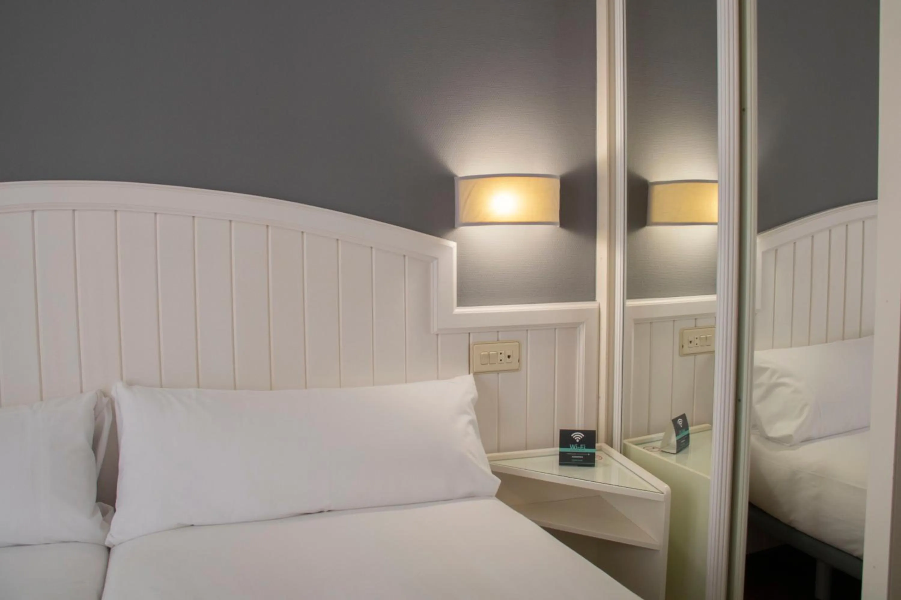 Bed in Alda Miramar Rooms