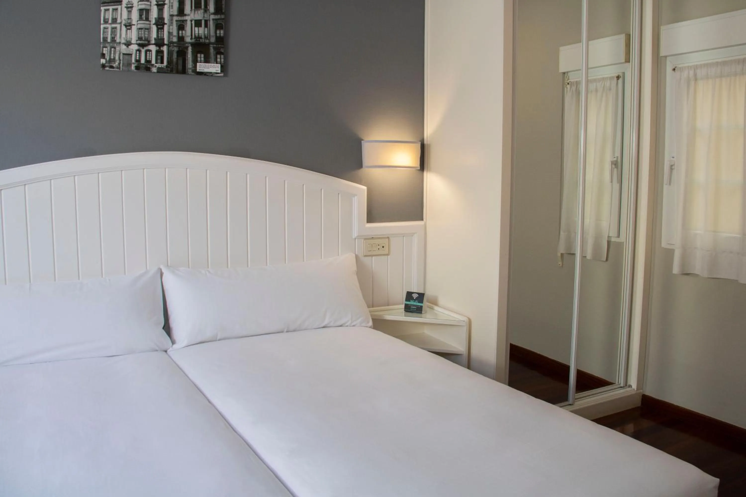 Bed in Alda Miramar Rooms