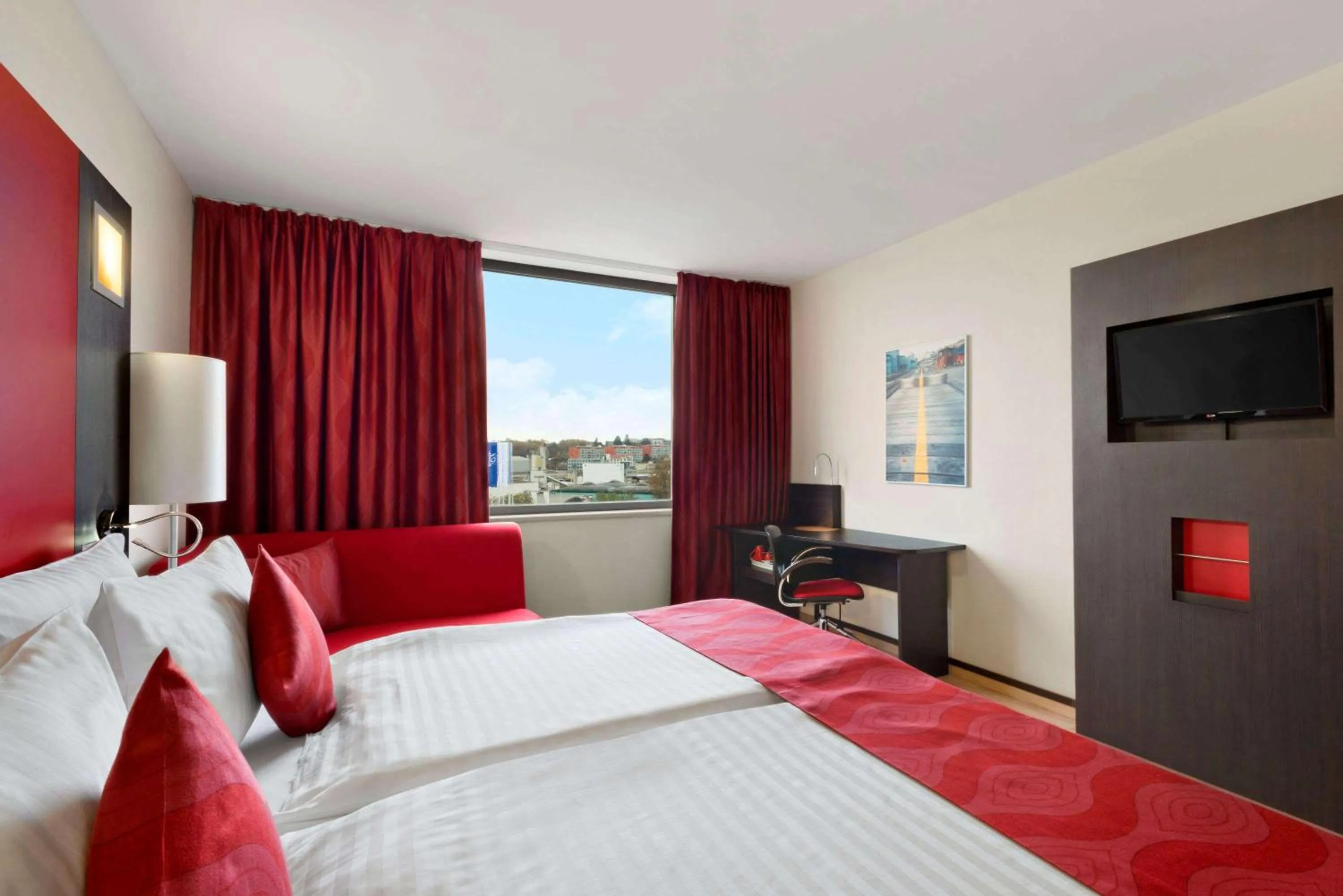 Photo of the whole room, Bed in Ramada Encore by Wyndham Geneva