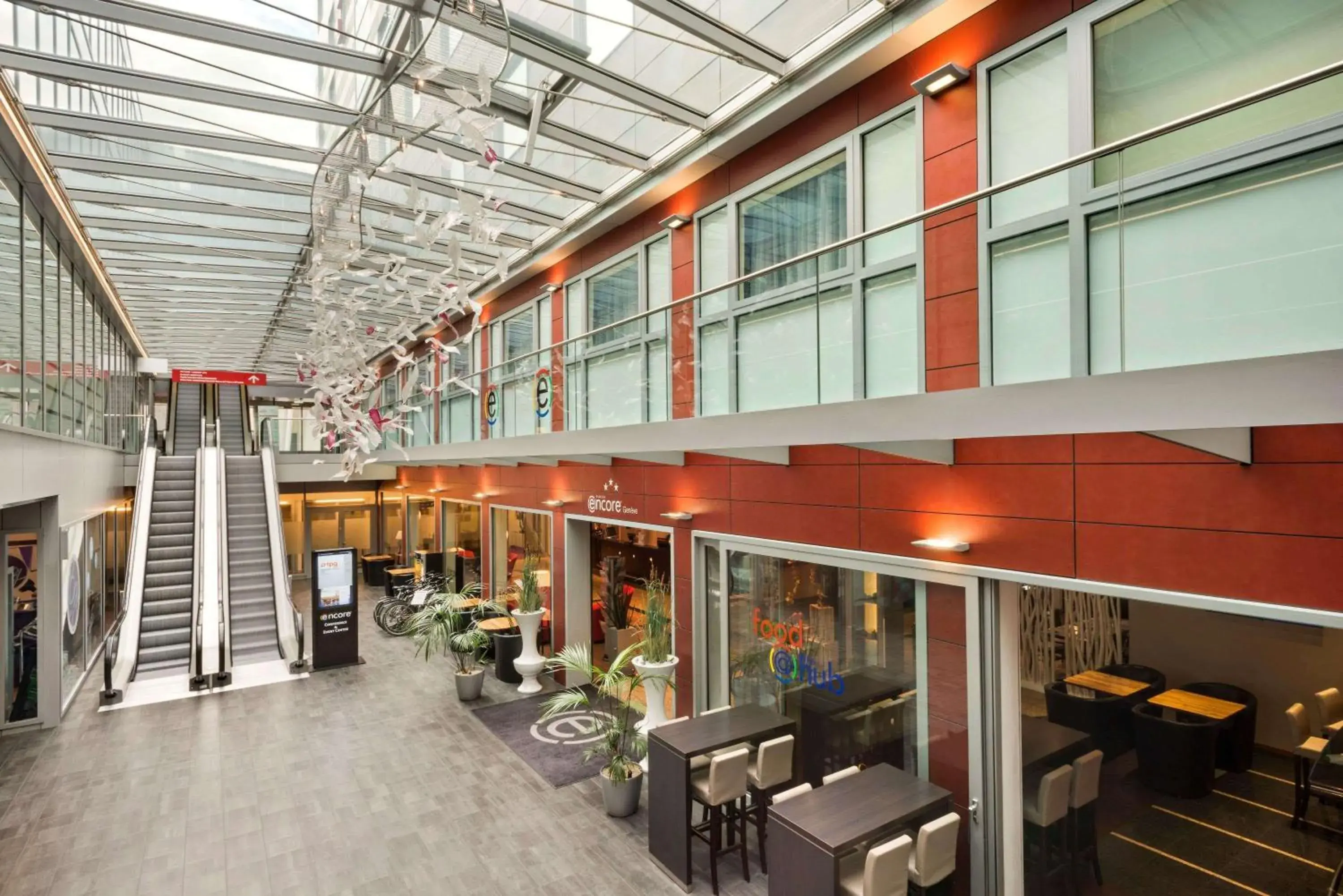 Lounge or bar in Ramada Encore by Wyndham Geneva Lounge or bar in Ramada Encore by Wyndham Geneva