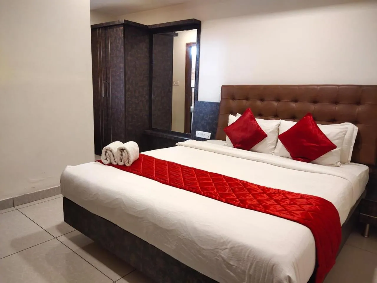 Bed in Hotel Golden Amulya Rest Wings