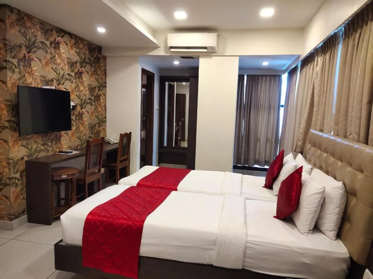 Bed in Hotel Golden Amulya Rest Wings