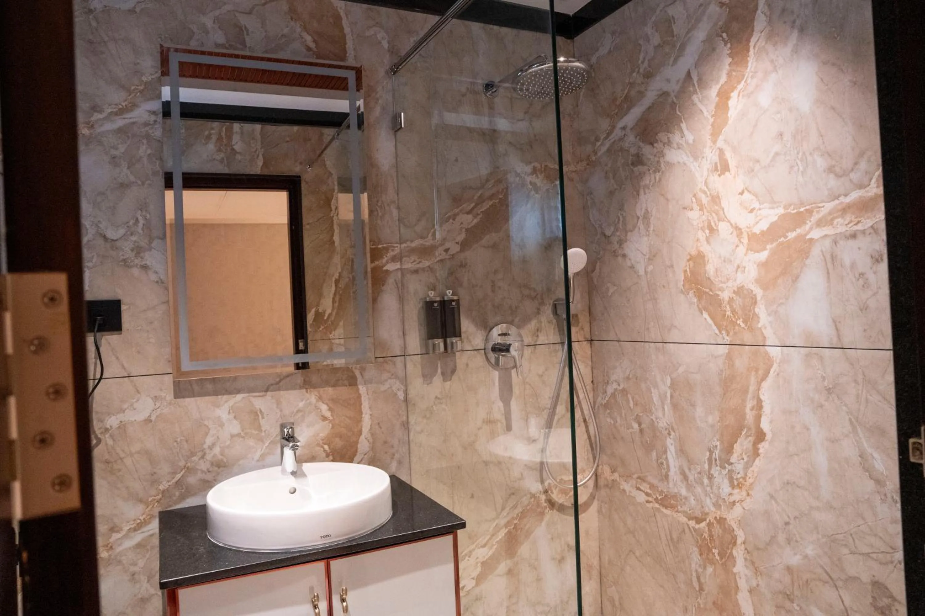 Shower in Hotel Golden Amulya Rest Wings