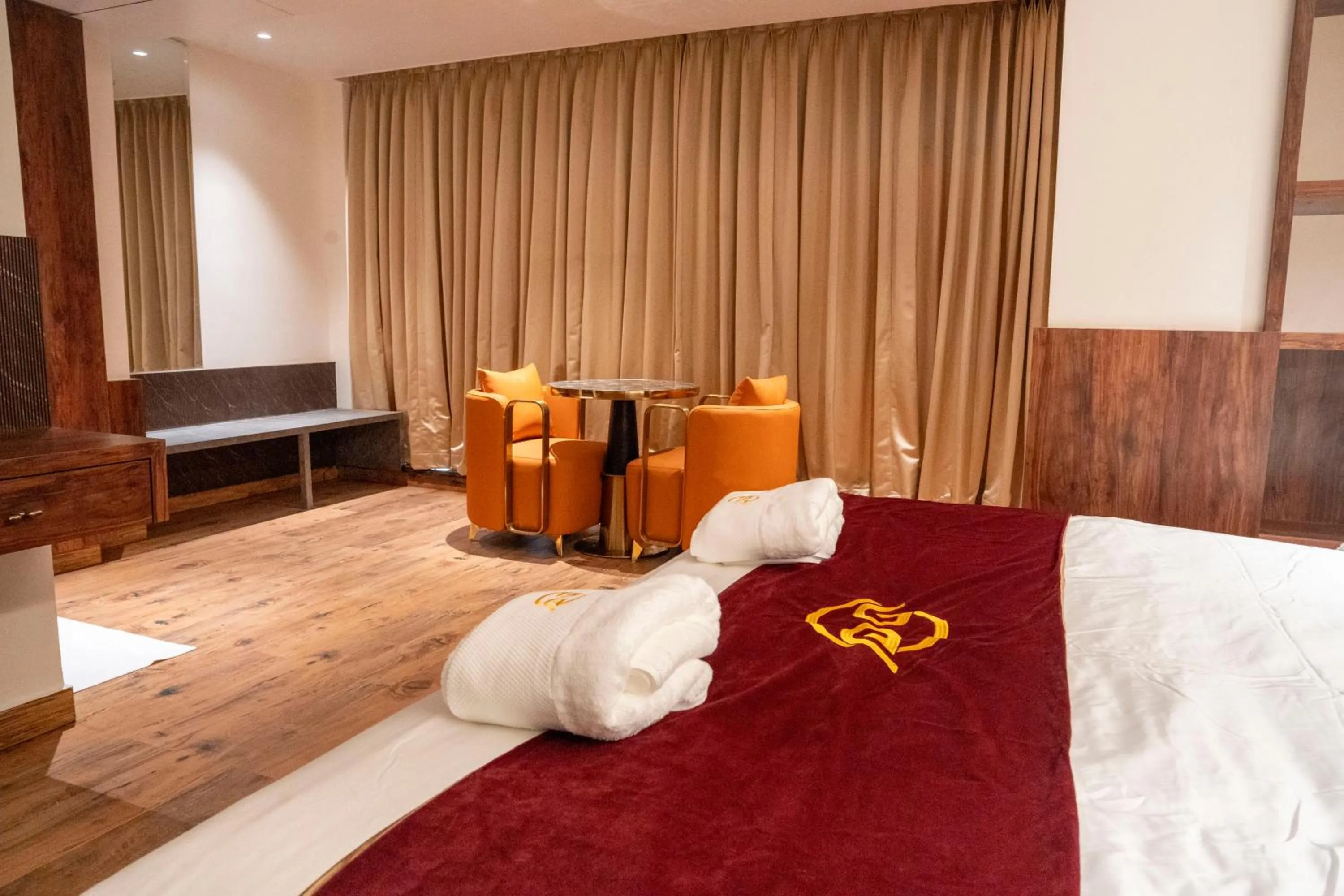 Bed in Hotel Golden Amulya Rest Wings