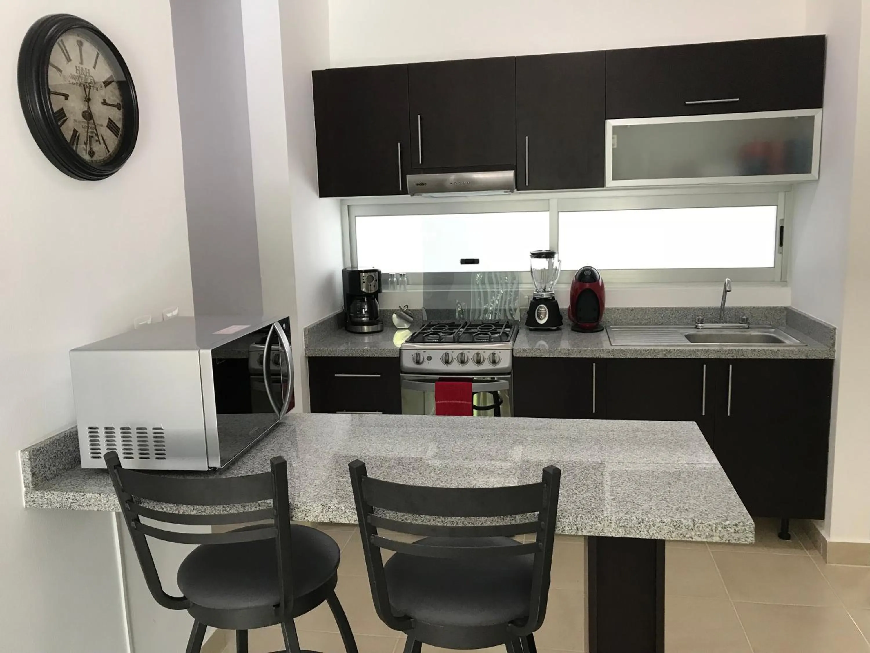 Kitchen or kitchenette in PLAYA SUITES apartment