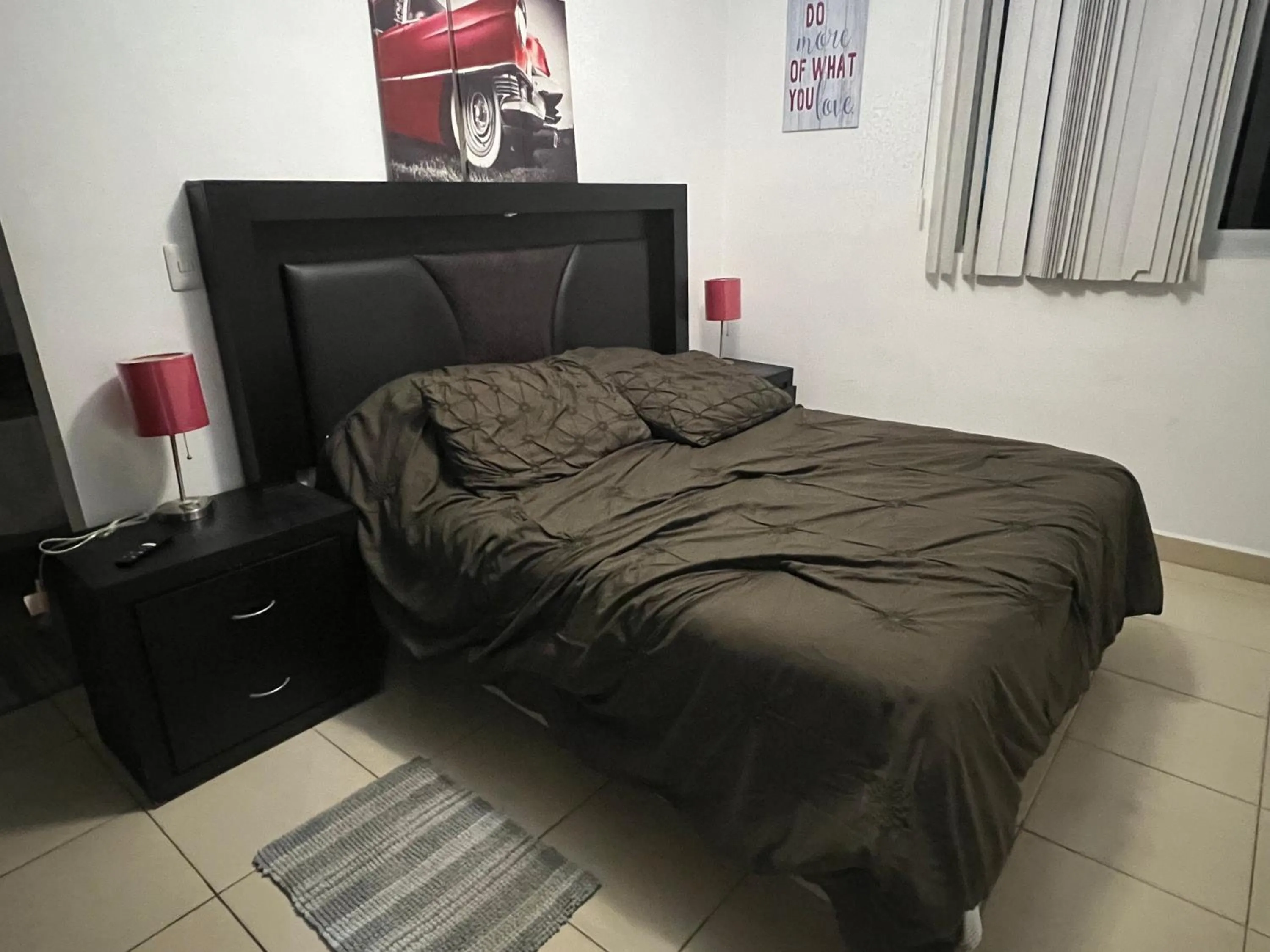 Bed in PLAYA SUITES apartment