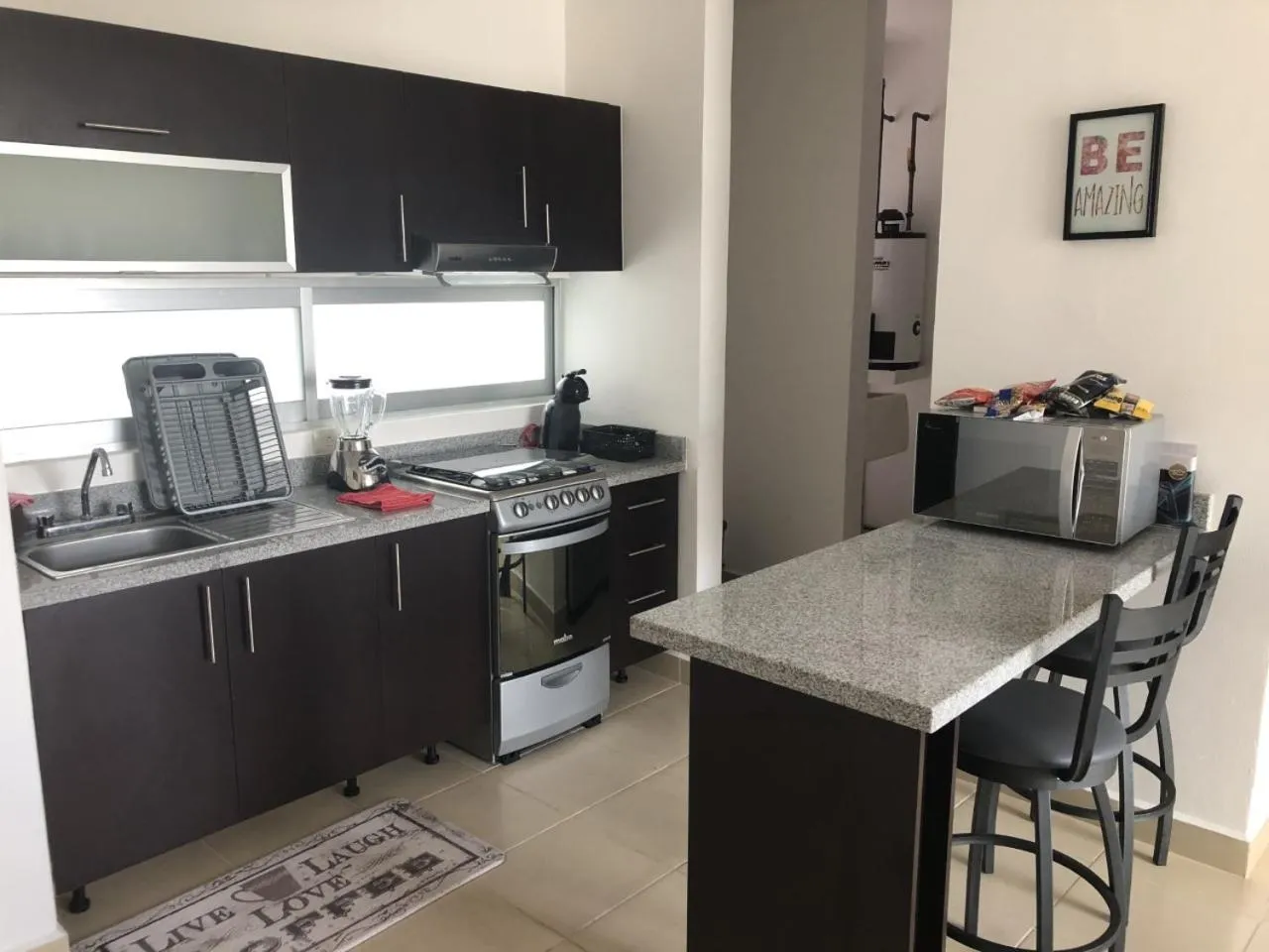 Kitchen or kitchenette in PLAYA SUITES apartment