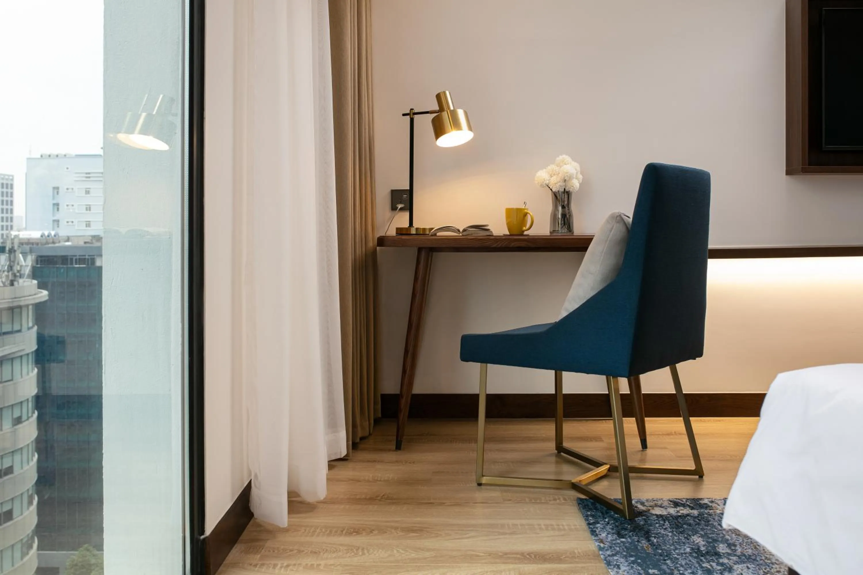 Seating area, Bed in Mövenpick Living West Hanoi