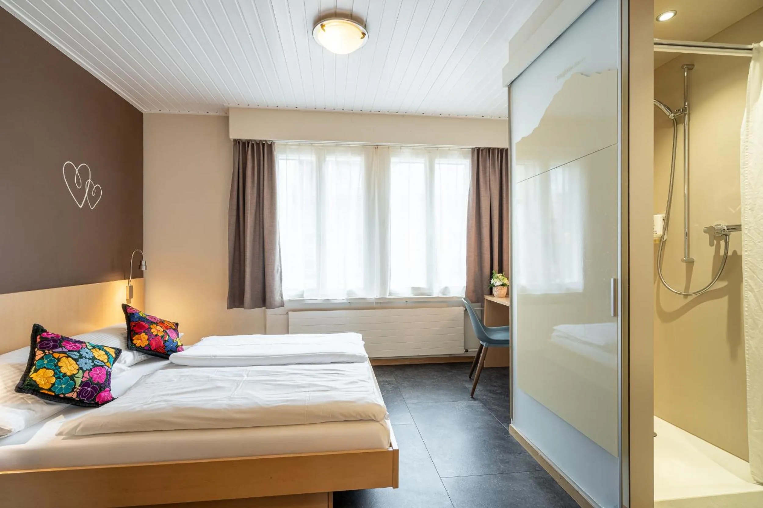 Bed in Hotel Blume Interlaken