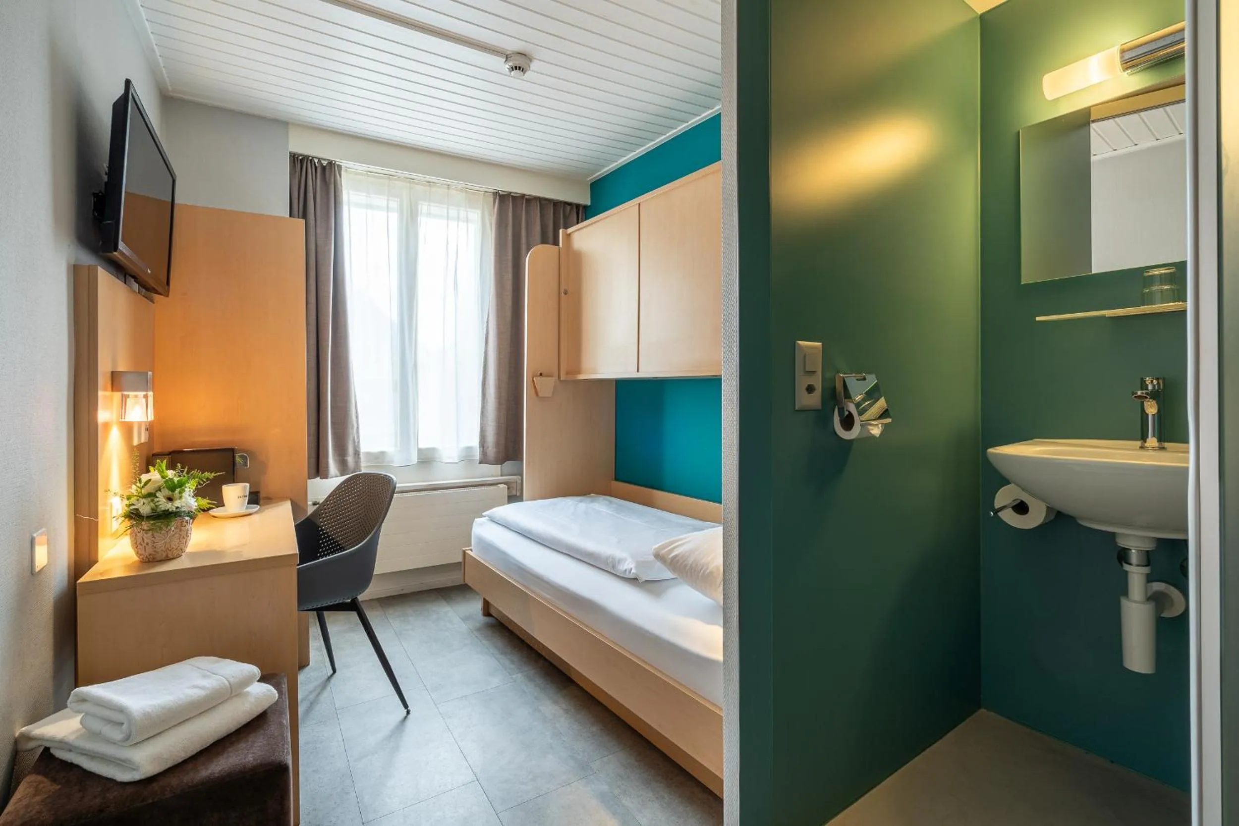 Bed in Hotel Blume Interlaken