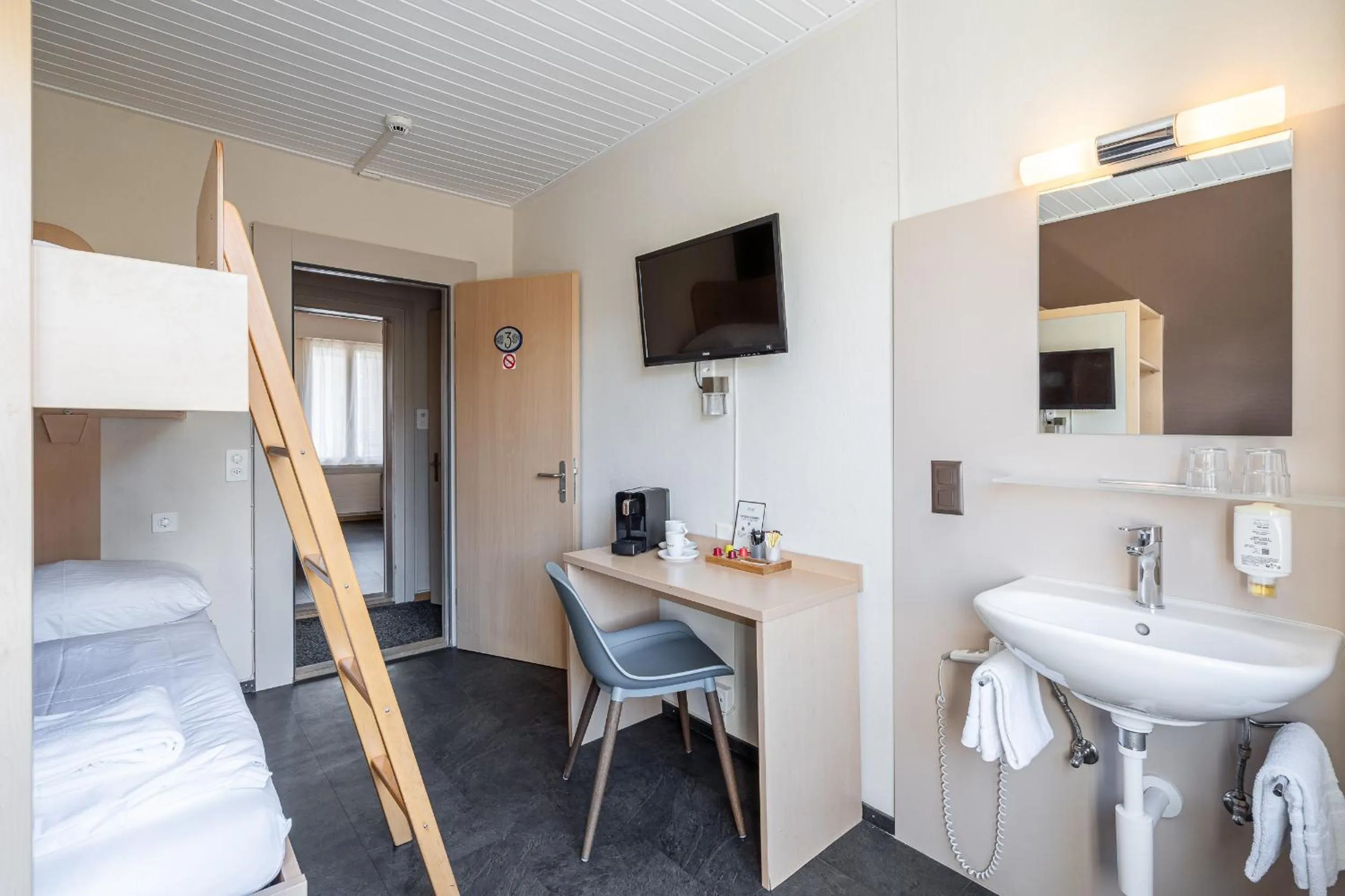 Bed in Hotel Blume Interlaken