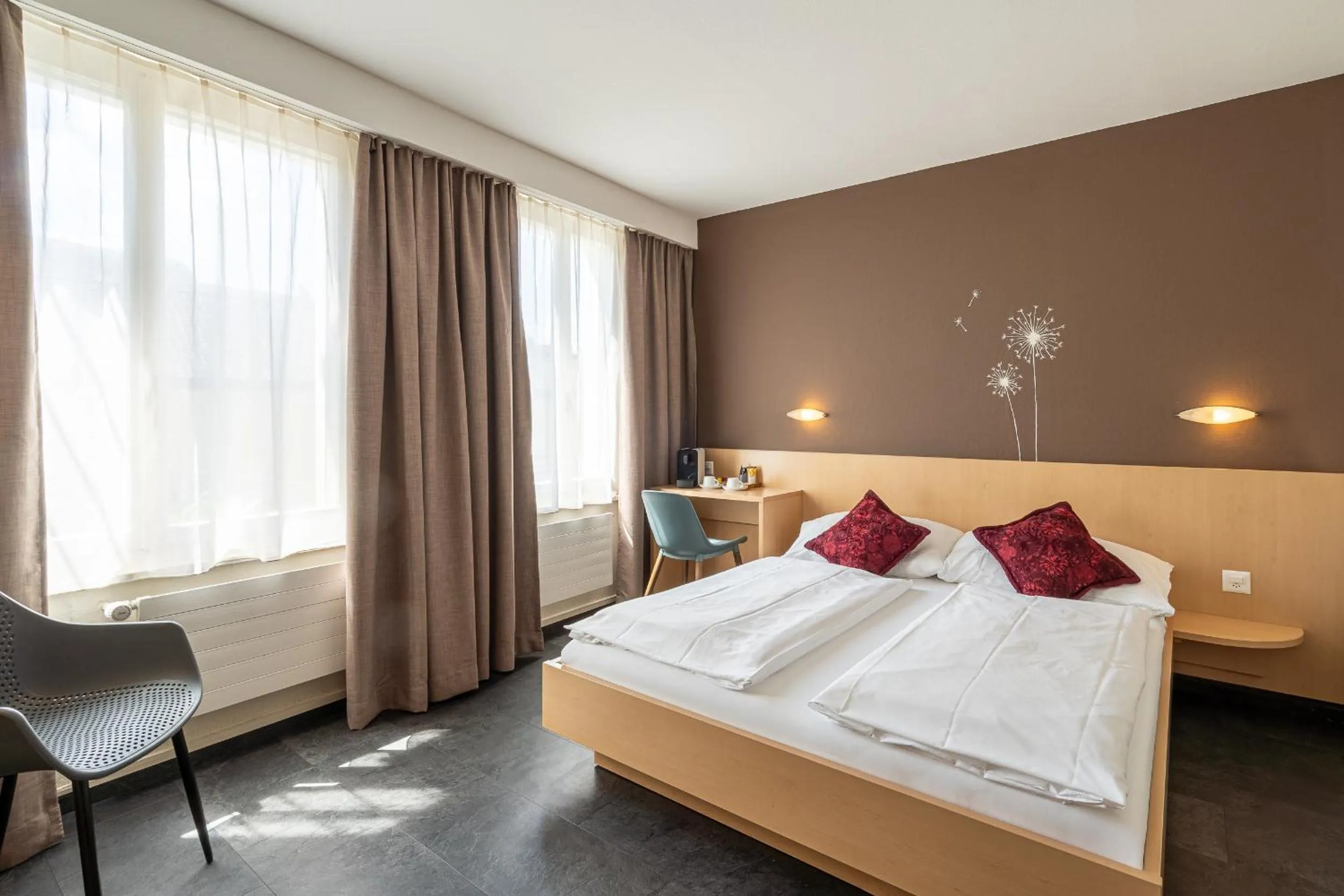 Bed in Hotel Blume Interlaken