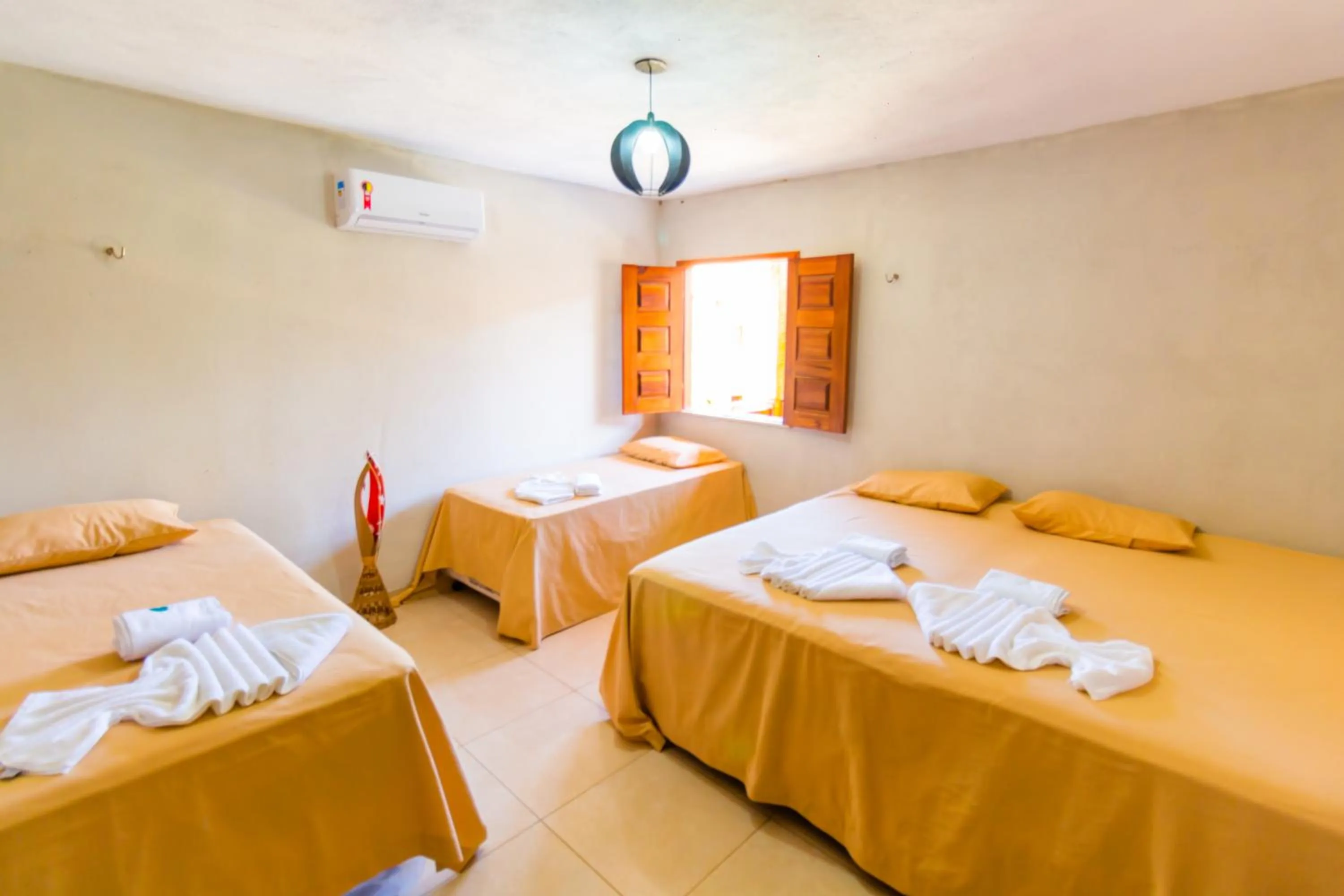 Bed in Pousada Recanto Beach