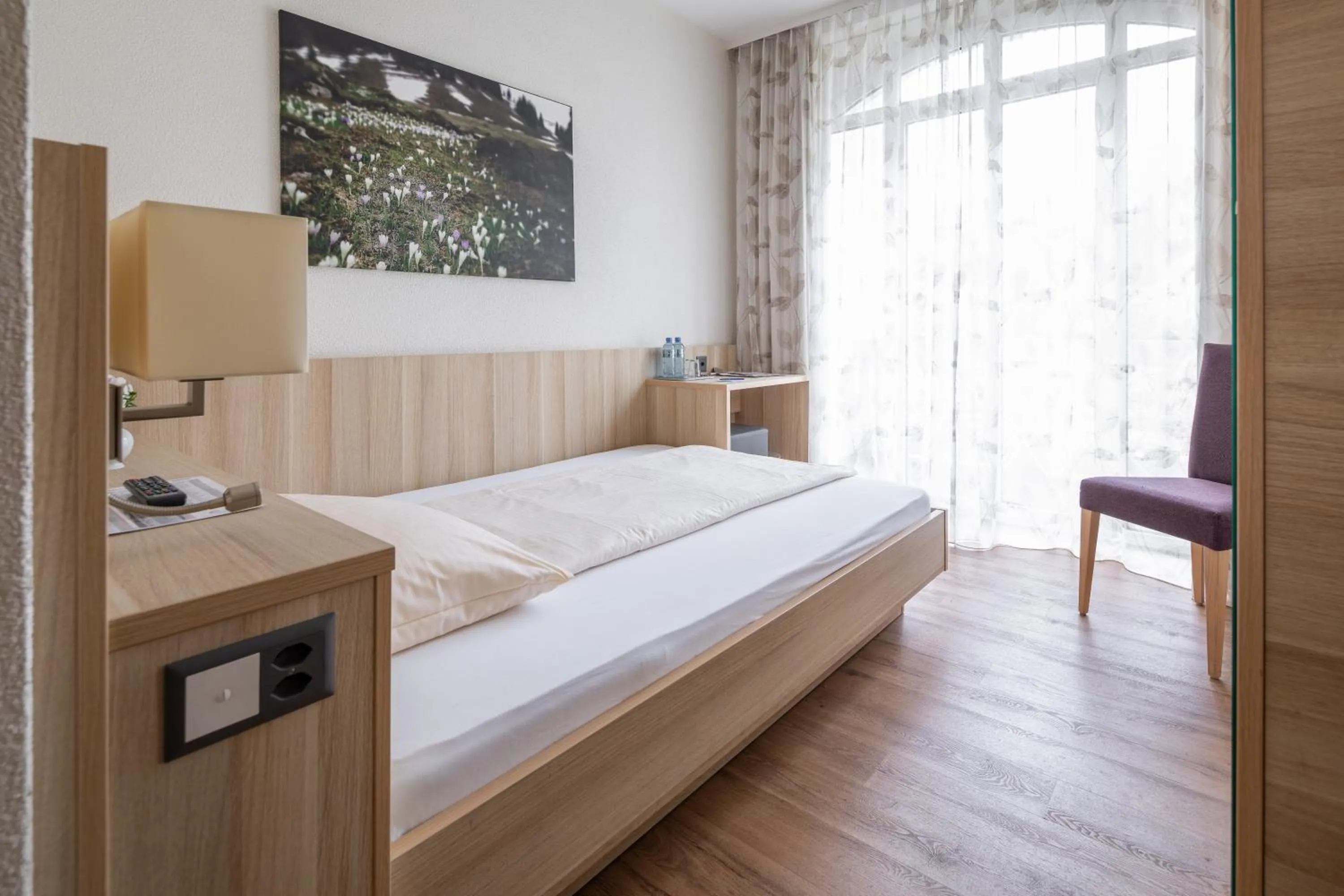 Photo of the whole room, Bed in Hotel Lötschberg