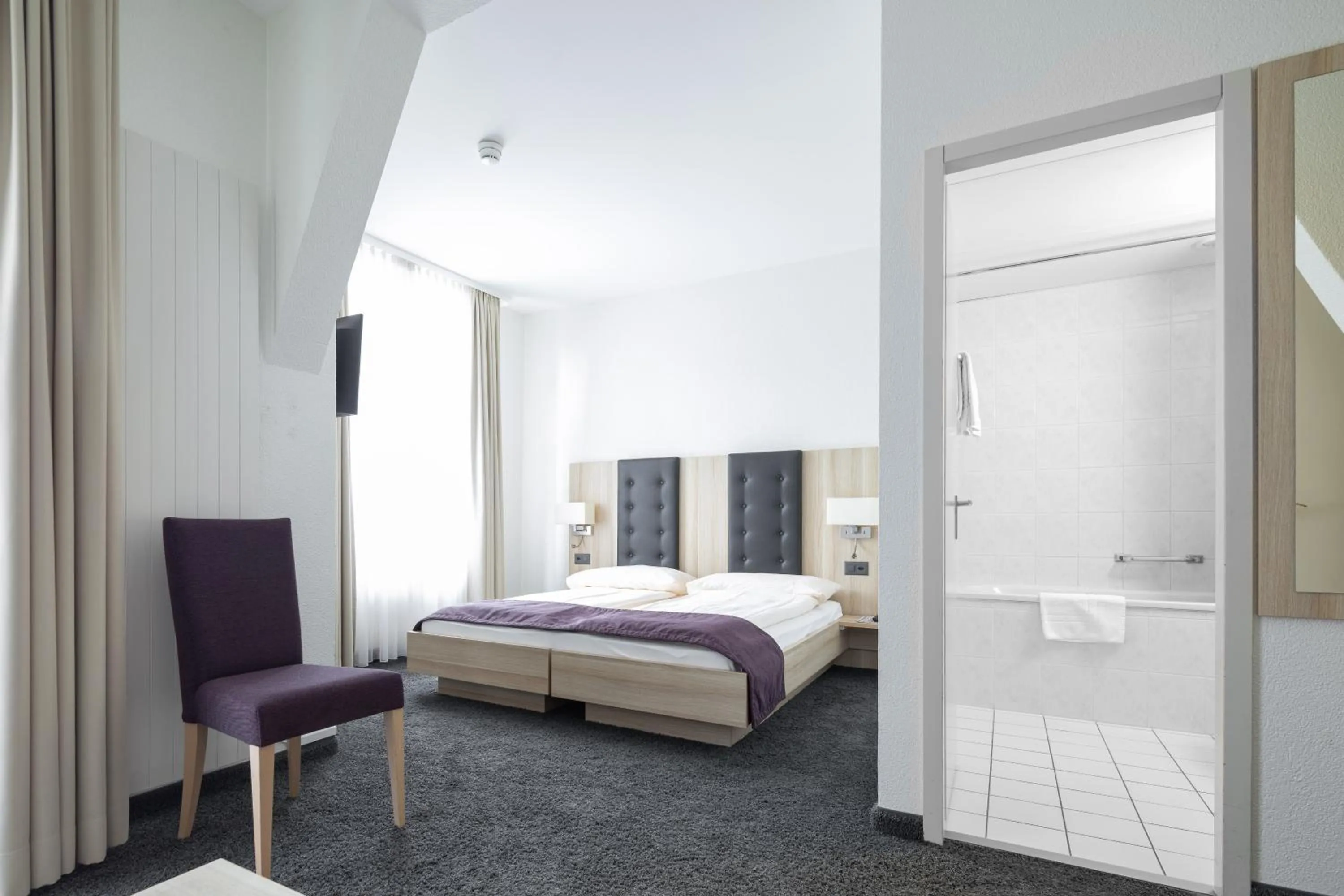 Photo of the whole room, Bed in Hotel Lötschberg