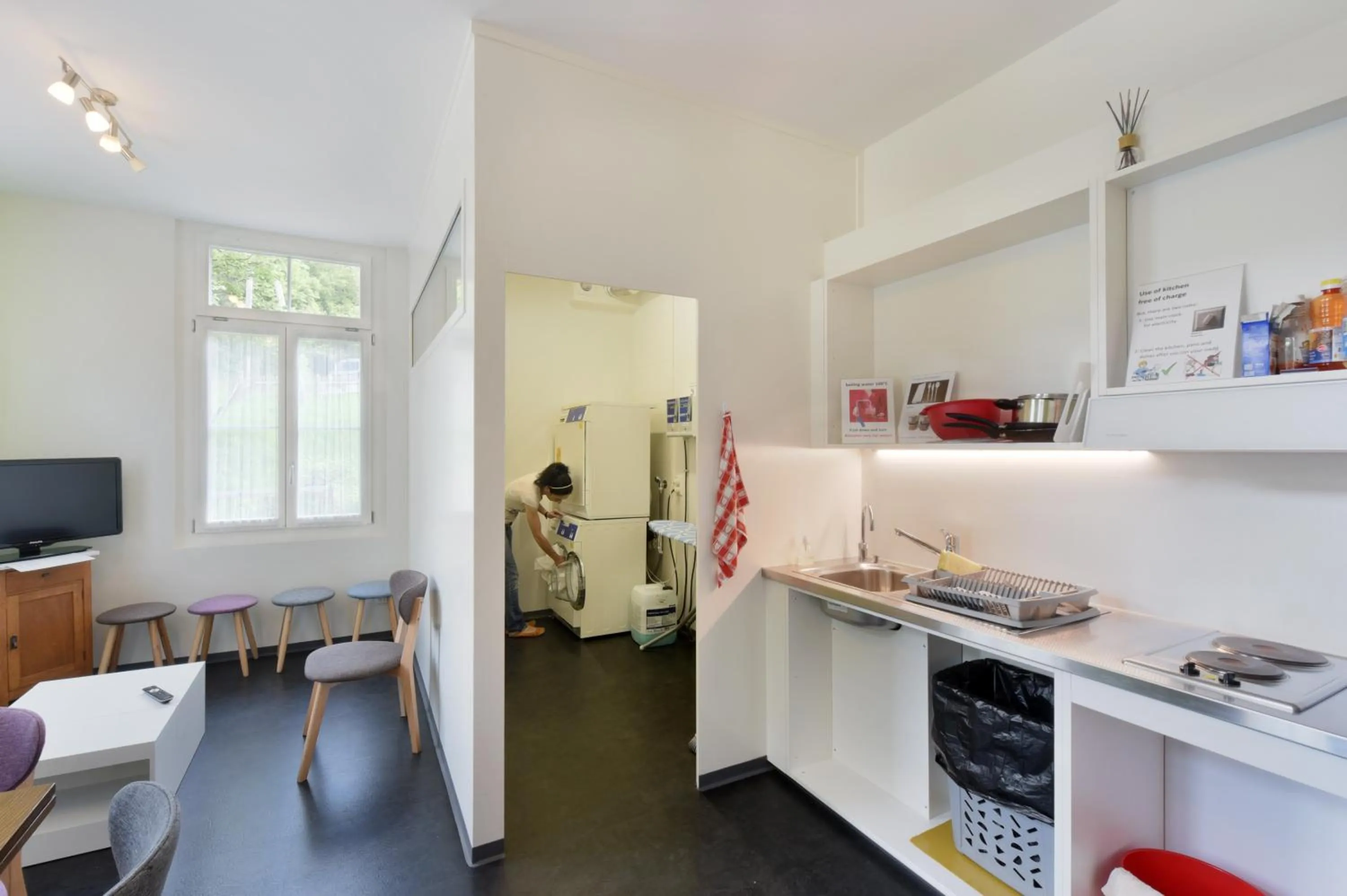 Communal lounge/ TV room in Waldhotel Unspunnen