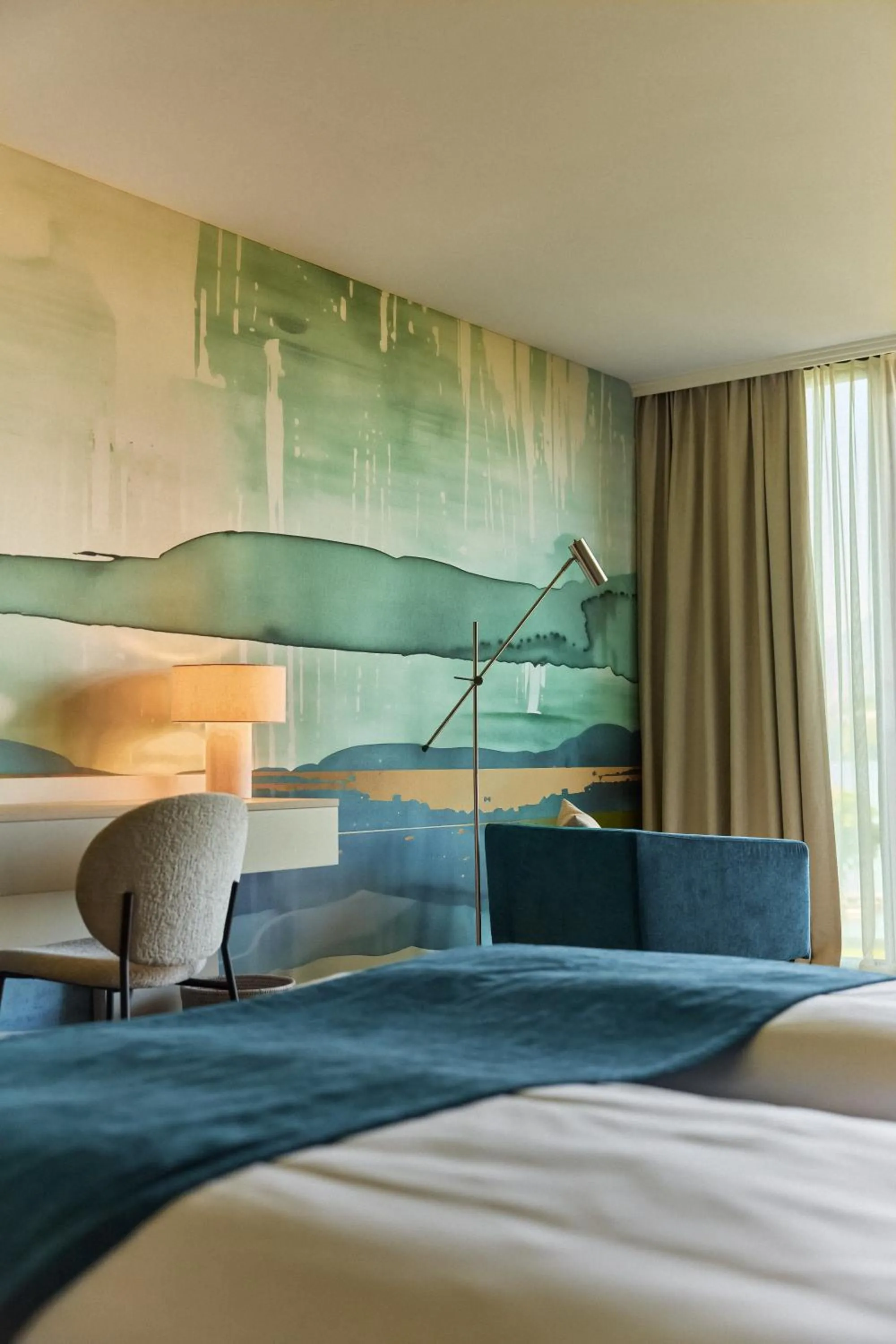 Living room, Bed in HERMITAGE Lake Lucerne - Beach Club & Lifestyle Hotel