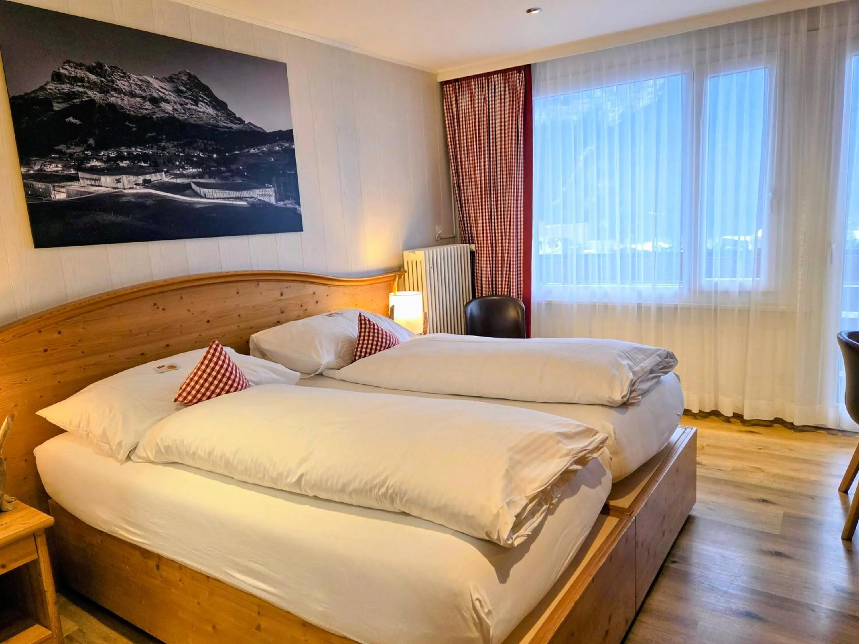 Photo of the whole room, Bed in Hotel Bernerhof Grindelwald