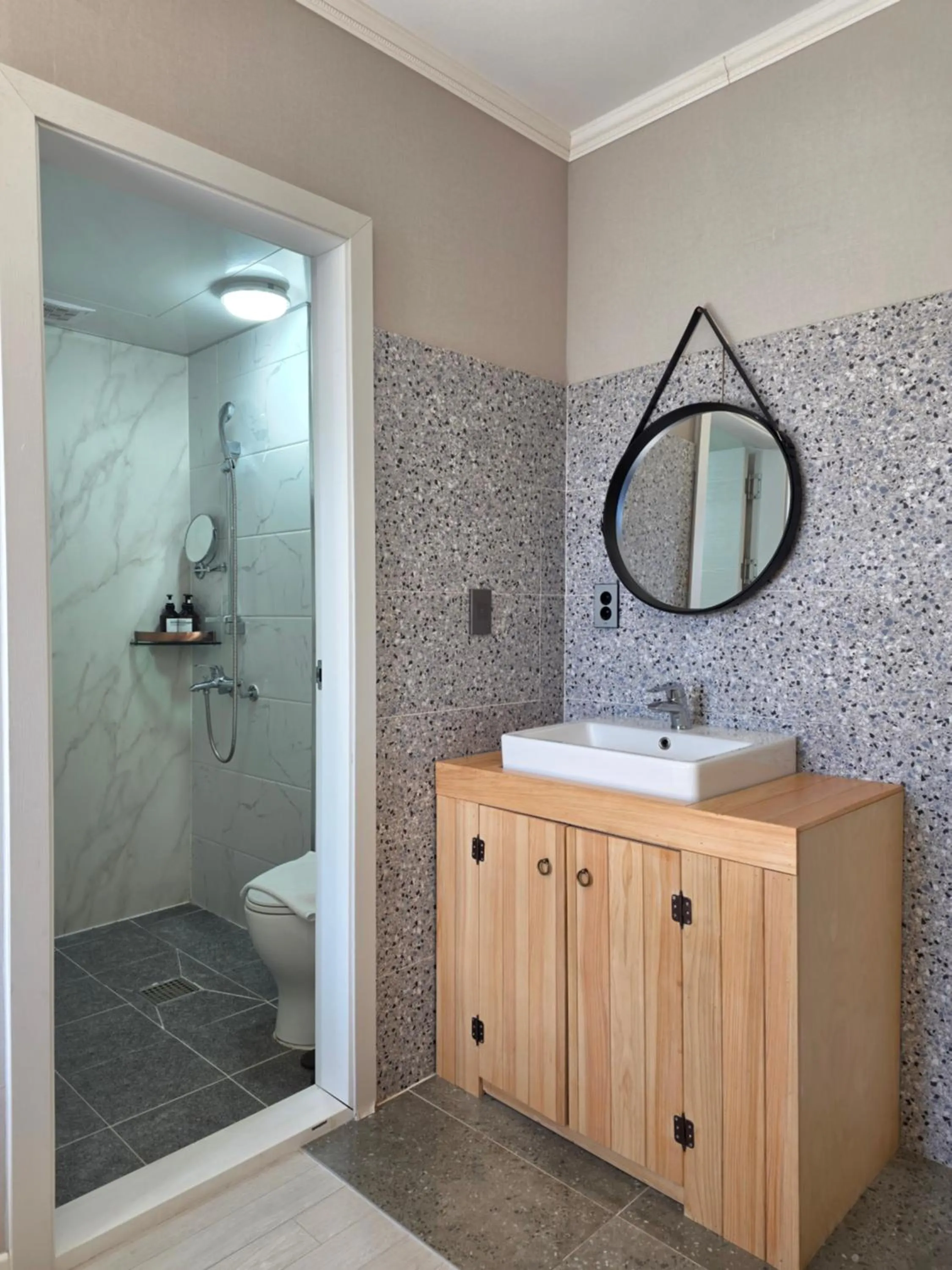 Toilet in Cornerstone Hotel