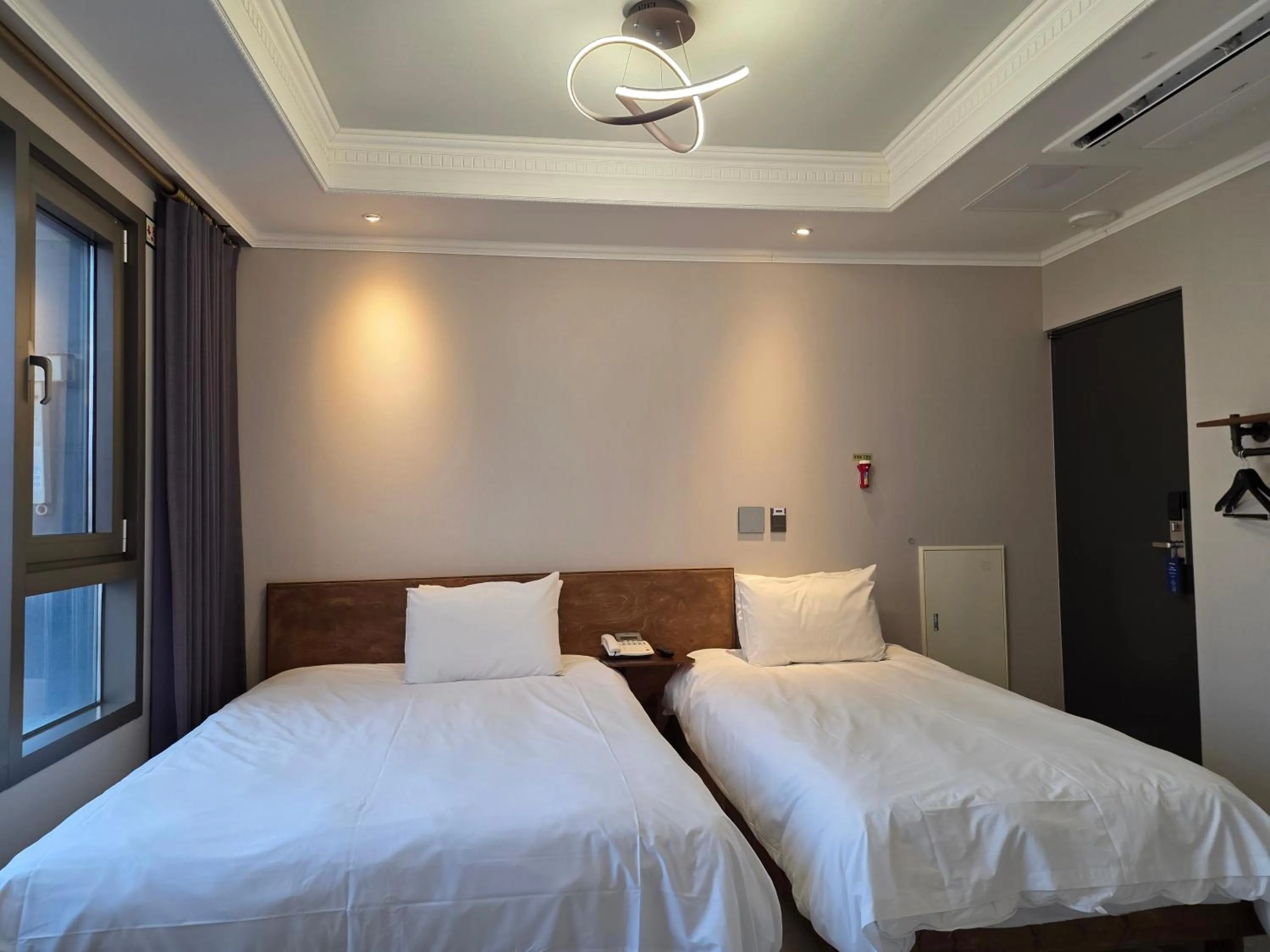 Bed in Cornerstone Hotel