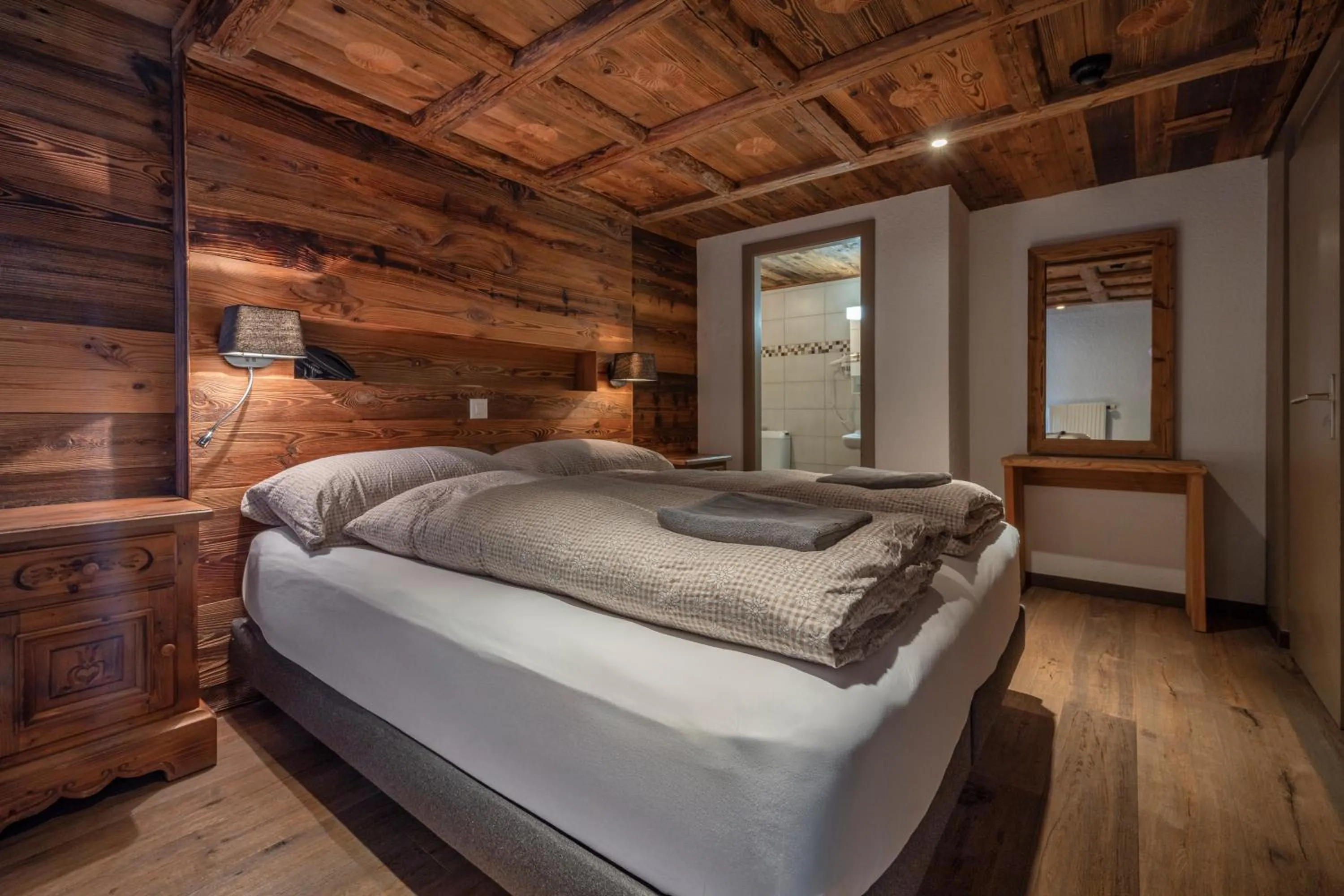 Bed in Hôtel Le Grand Chalet