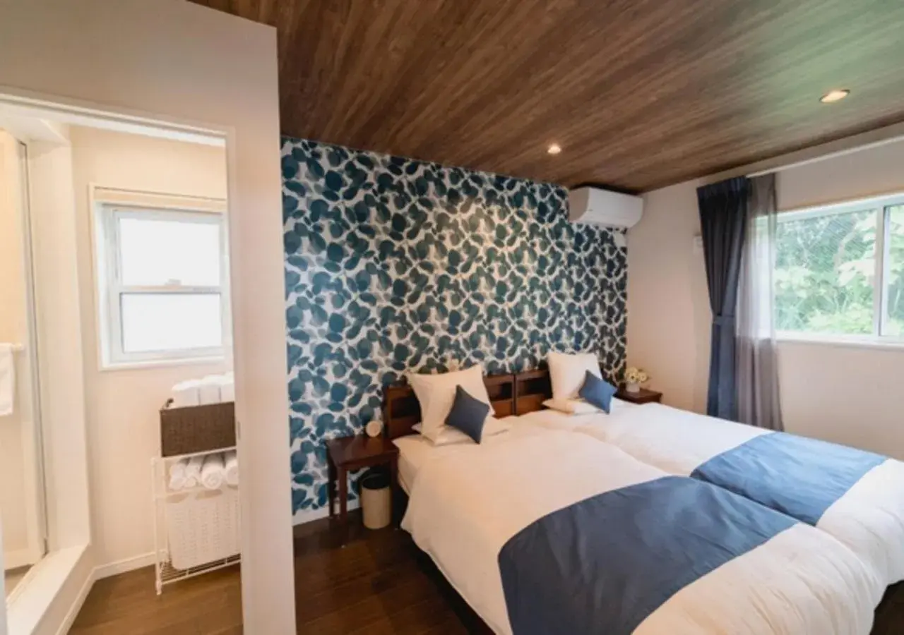 Bed in BEVERLY HILLS VILLA Miyakojima Resort Bed in BEVERLY HILLS VILLA Miyakojima Resort