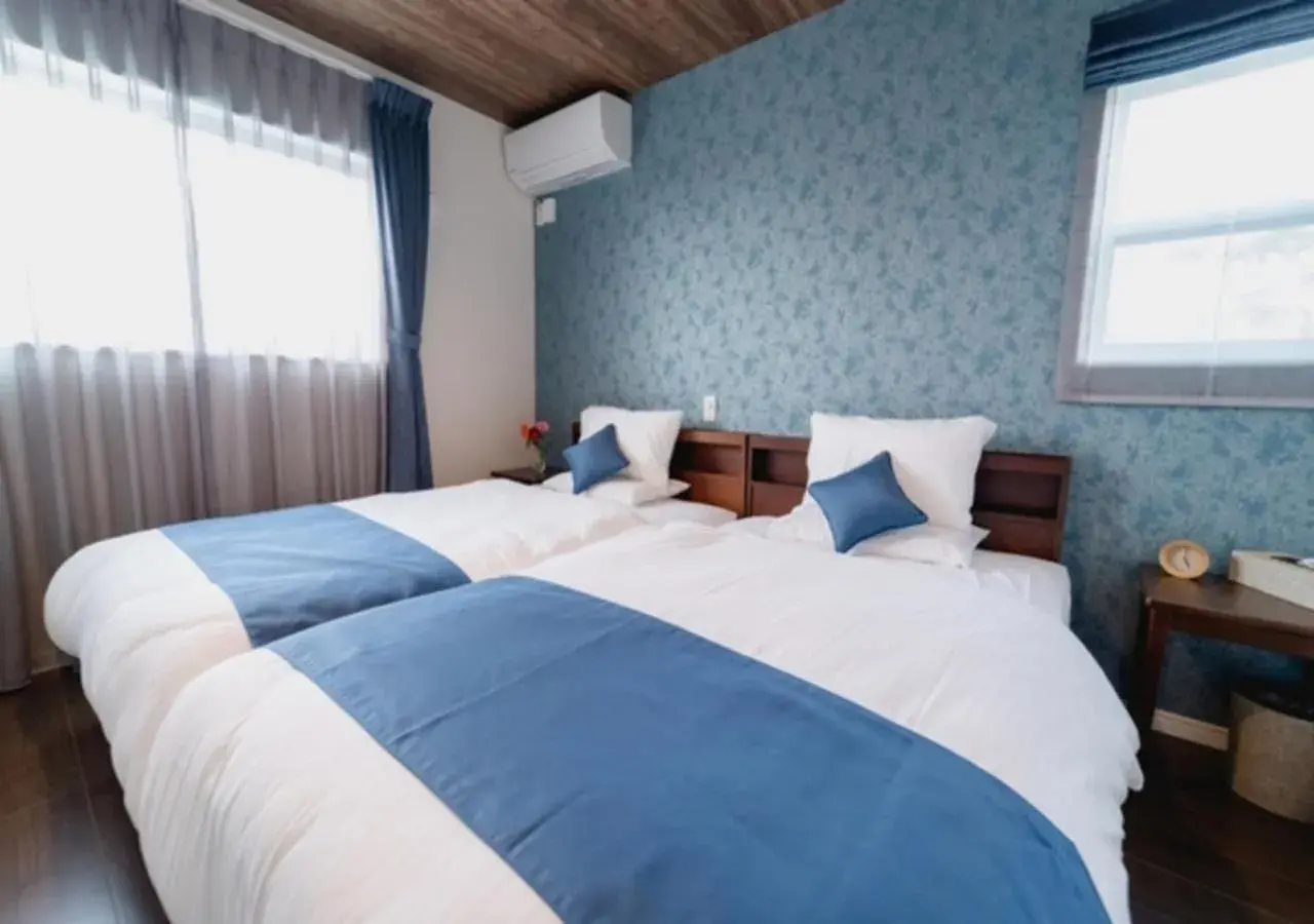 Bed in BEVERLY HILLS VILLA Miyakojima Resort Bed in BEVERLY HILLS VILLA Miyakojima Resort