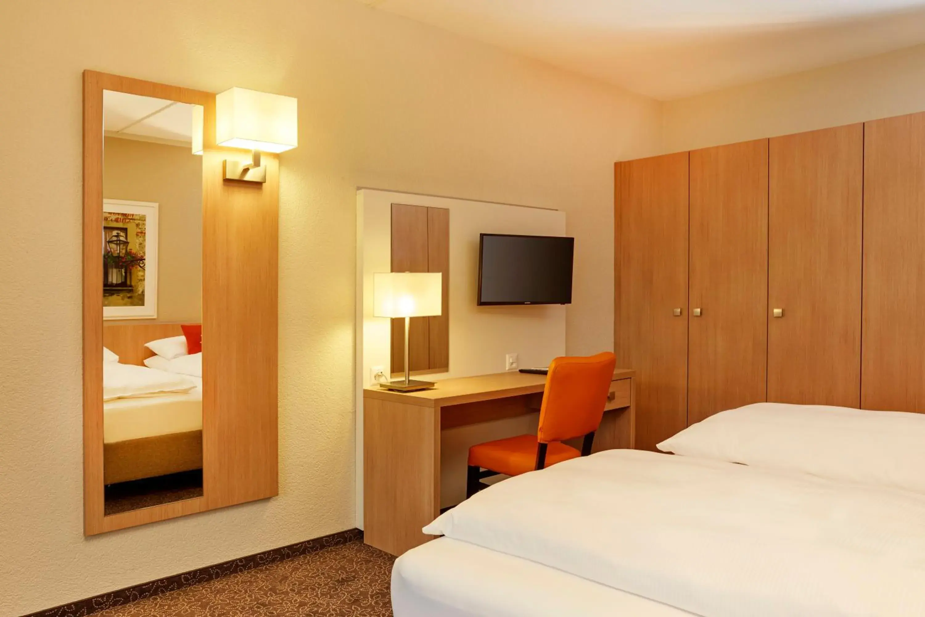 Photo of the whole room, Bed in H4 Hotel Arcadia Locarno Photo of the whole room, Bed in H4 Hotel Arcadia Locarno