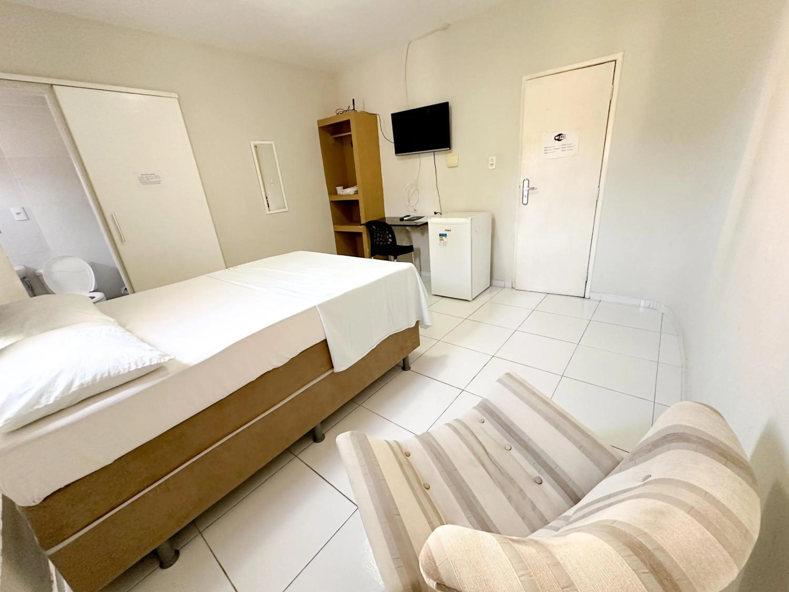 Communal lounge/ TV room, Bed in Hotel Oiticica