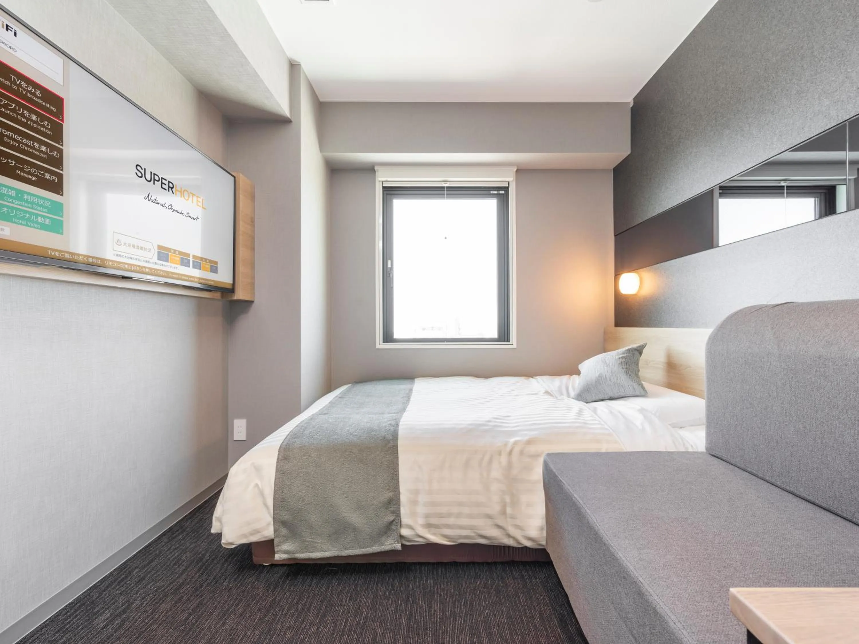 Bed in Super Hotel Premier Kanazawaeki Higashiguchi