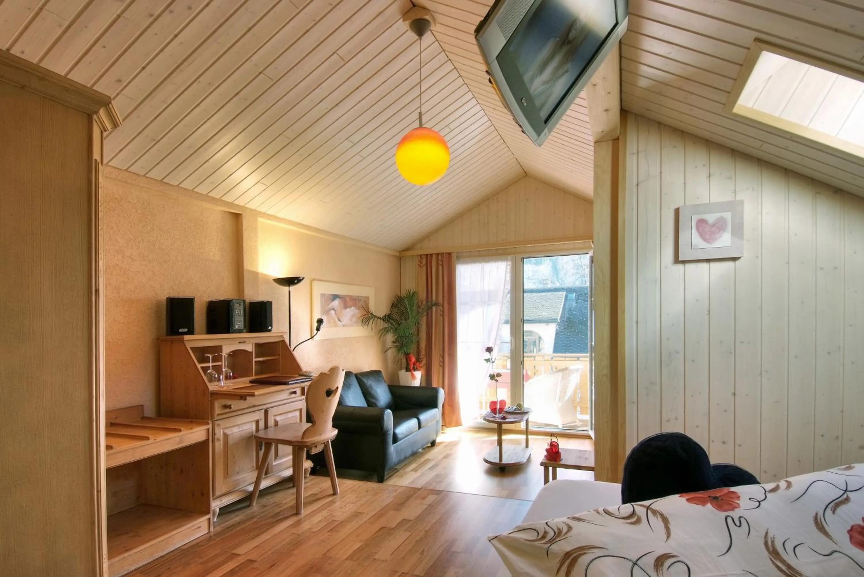Living room, Bed in Chalet Hotel Adler