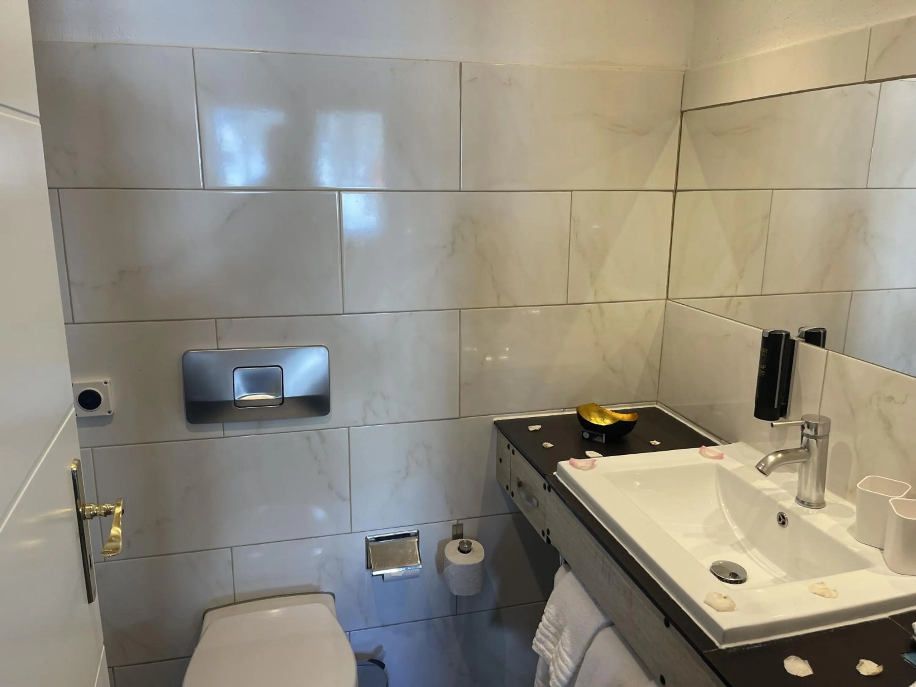 Bathroom in Chalet Hotel Adler