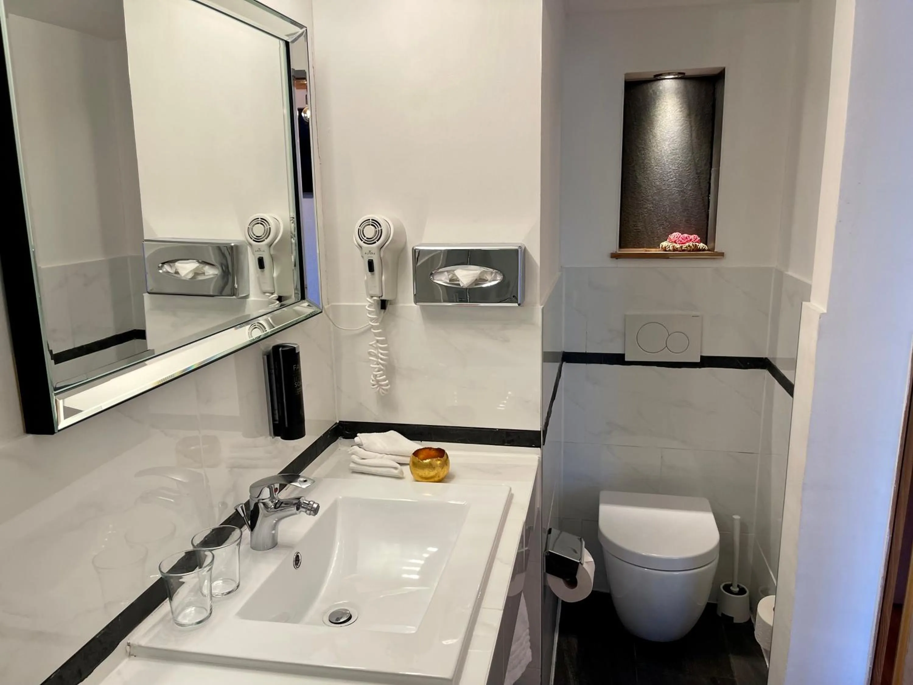 Bathroom in Chalet Hotel Adler