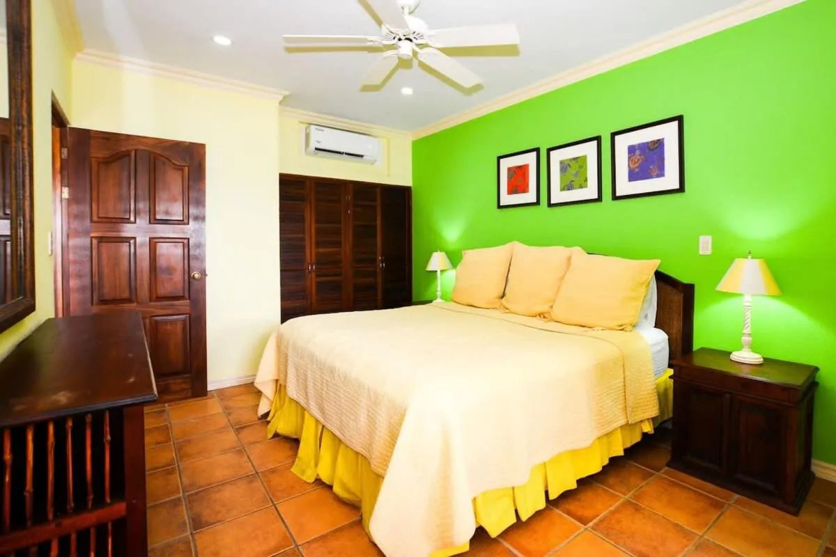 Bed in Elegant 3BR Beachfront Condo with Spacious Interior, Ocean-View Terrace & Direct Access to Playa Flamingo